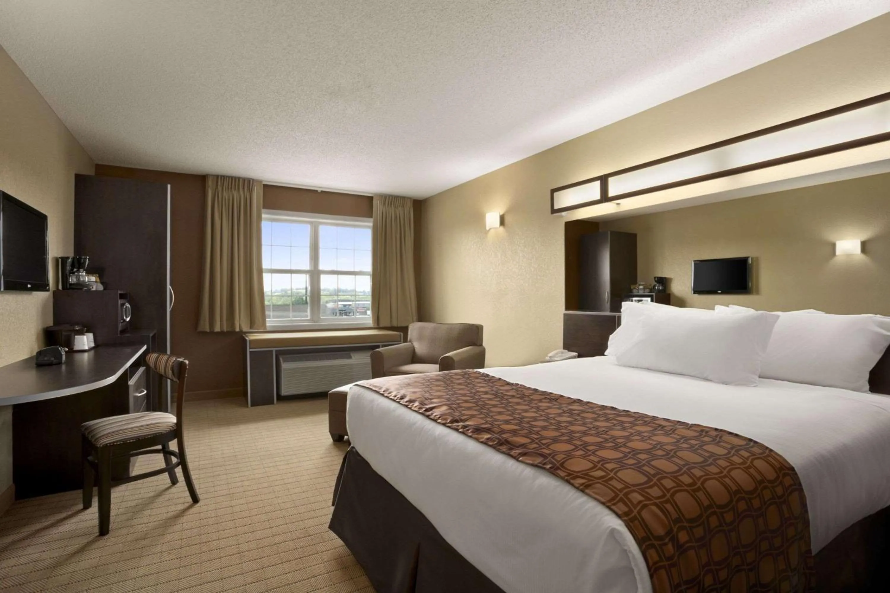 Photo of the whole room, Bed in Microtel Inn & Suites By Wyndham Mineral Wells/Parkersburg