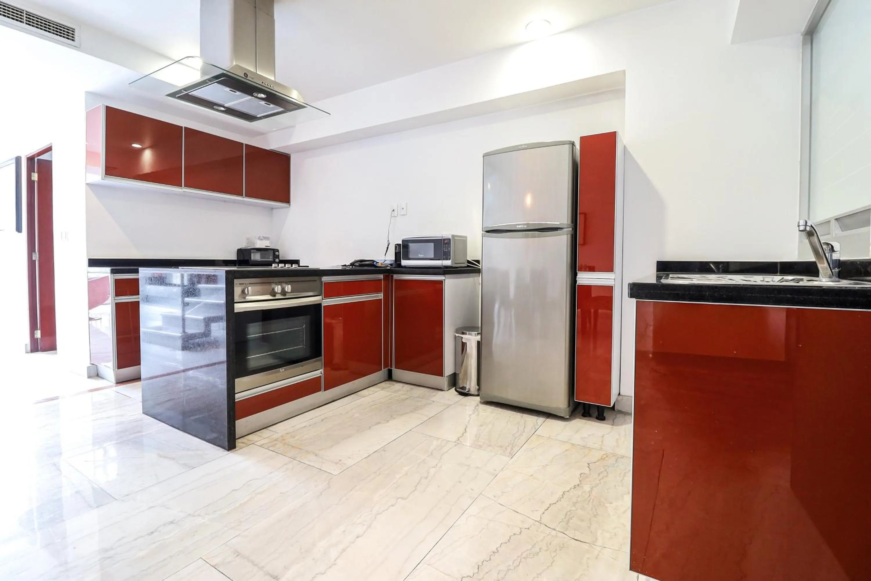 Kitchen or kitchenette in St Isidro Suites Corporate Housing SPA & Wellness Center