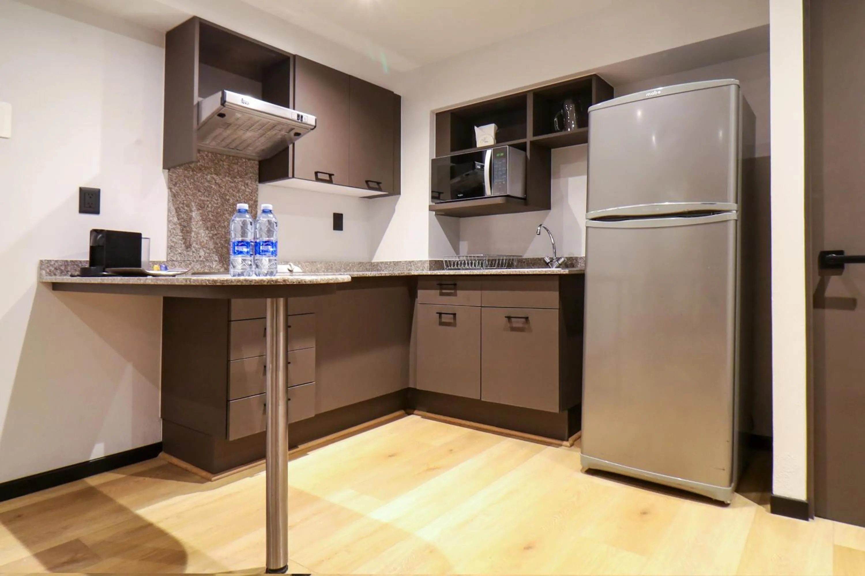 Kitchen or kitchenette in St Isidro Suites Corporate Housing SPA & Wellness Center
