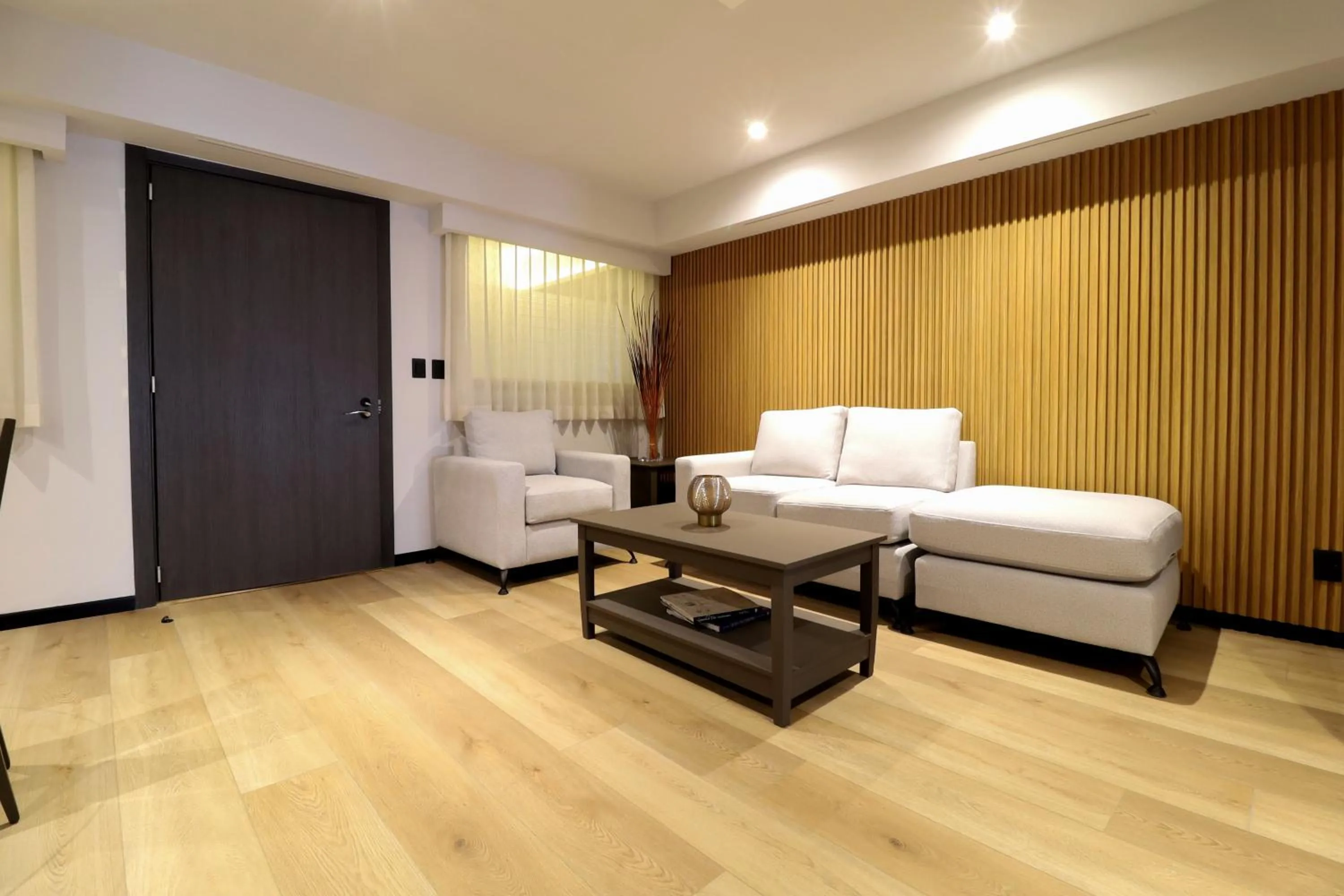 Living room, Bed in St Isidro Suites Corporate Housing SPA & Wellness Center