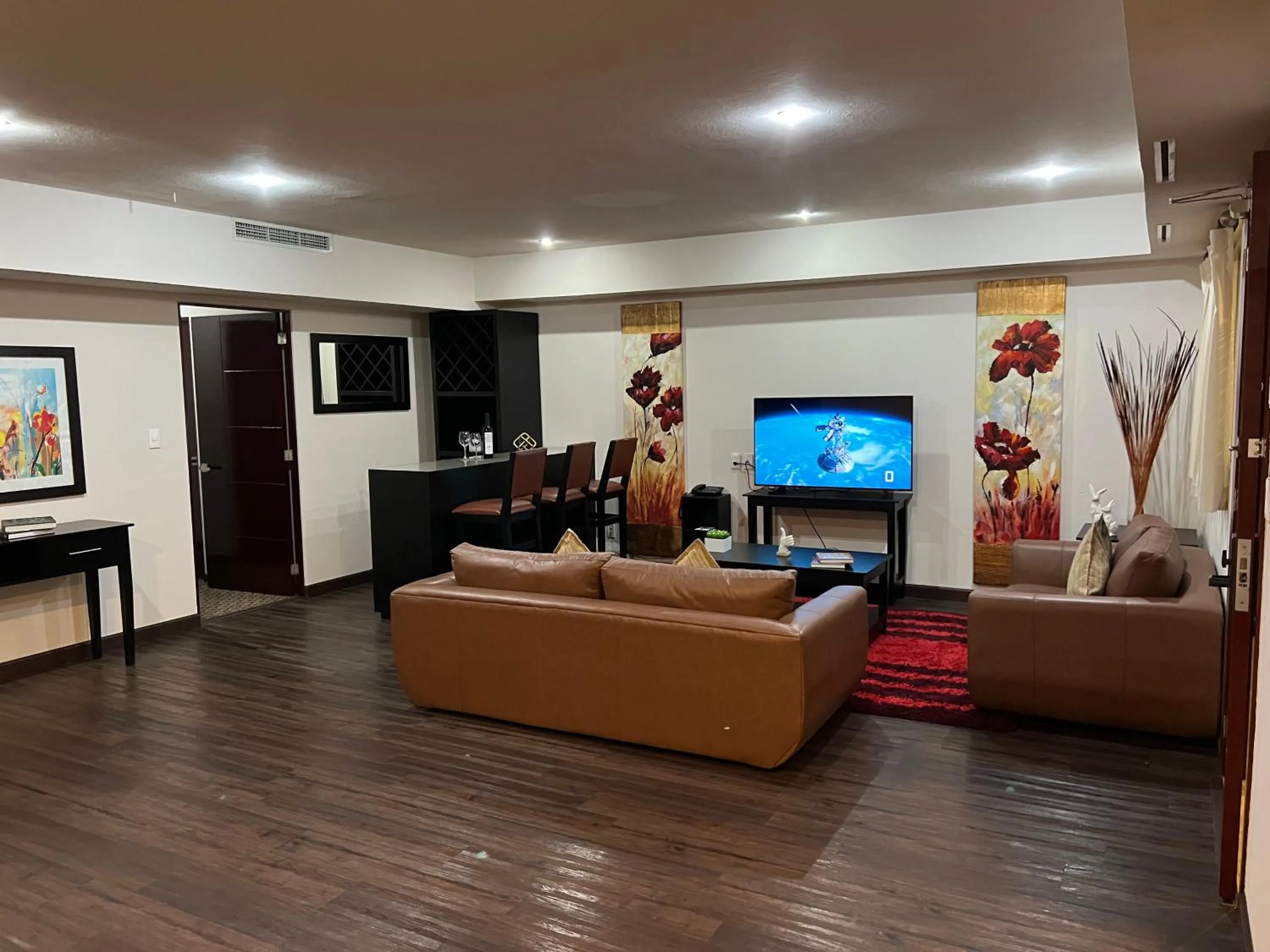 TV and multimedia in St Isidro Suites Corporate Housing SPA & Wellness Center