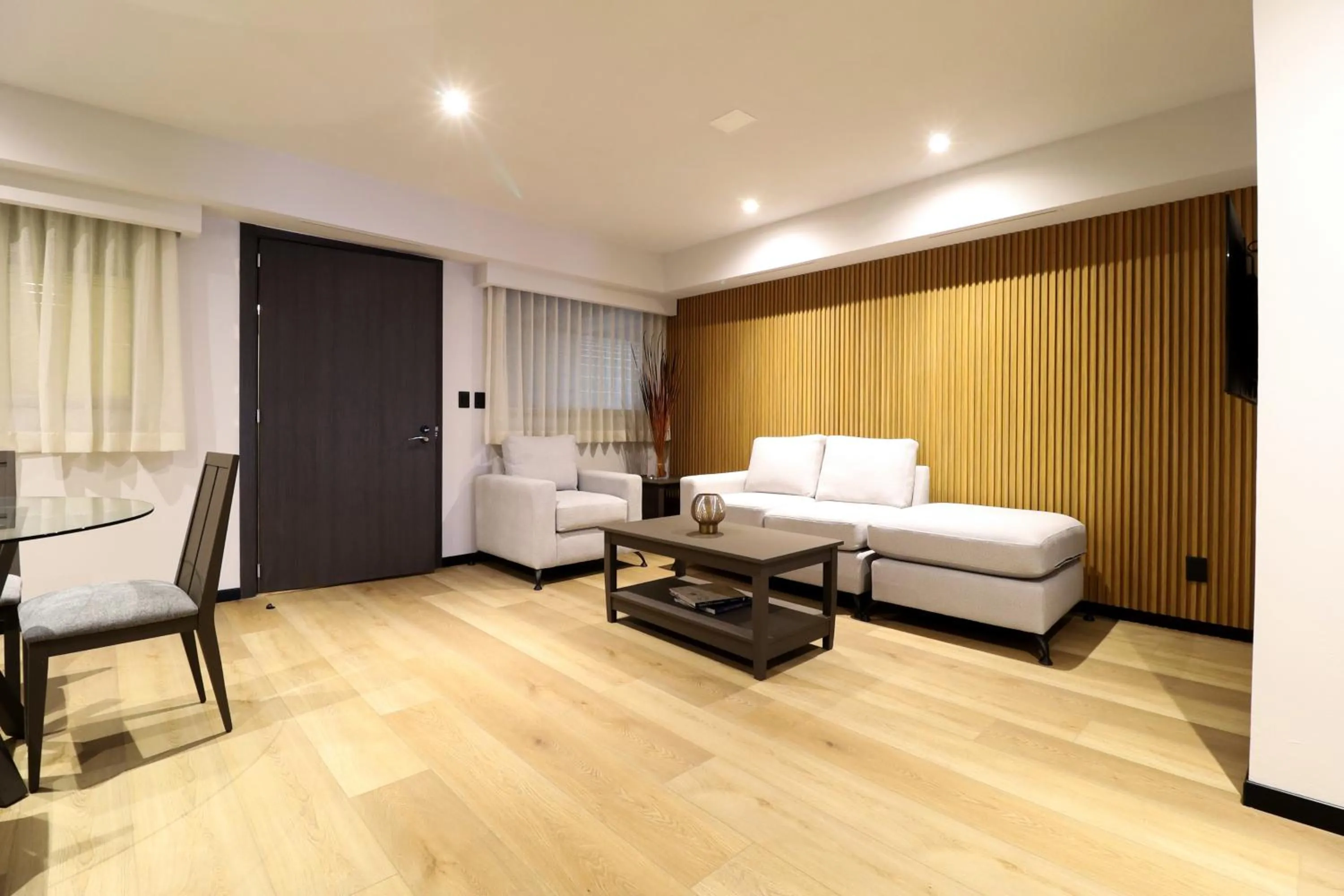 Living room, Bed in St Isidro Suites Corporate Housing SPA & Wellness Center