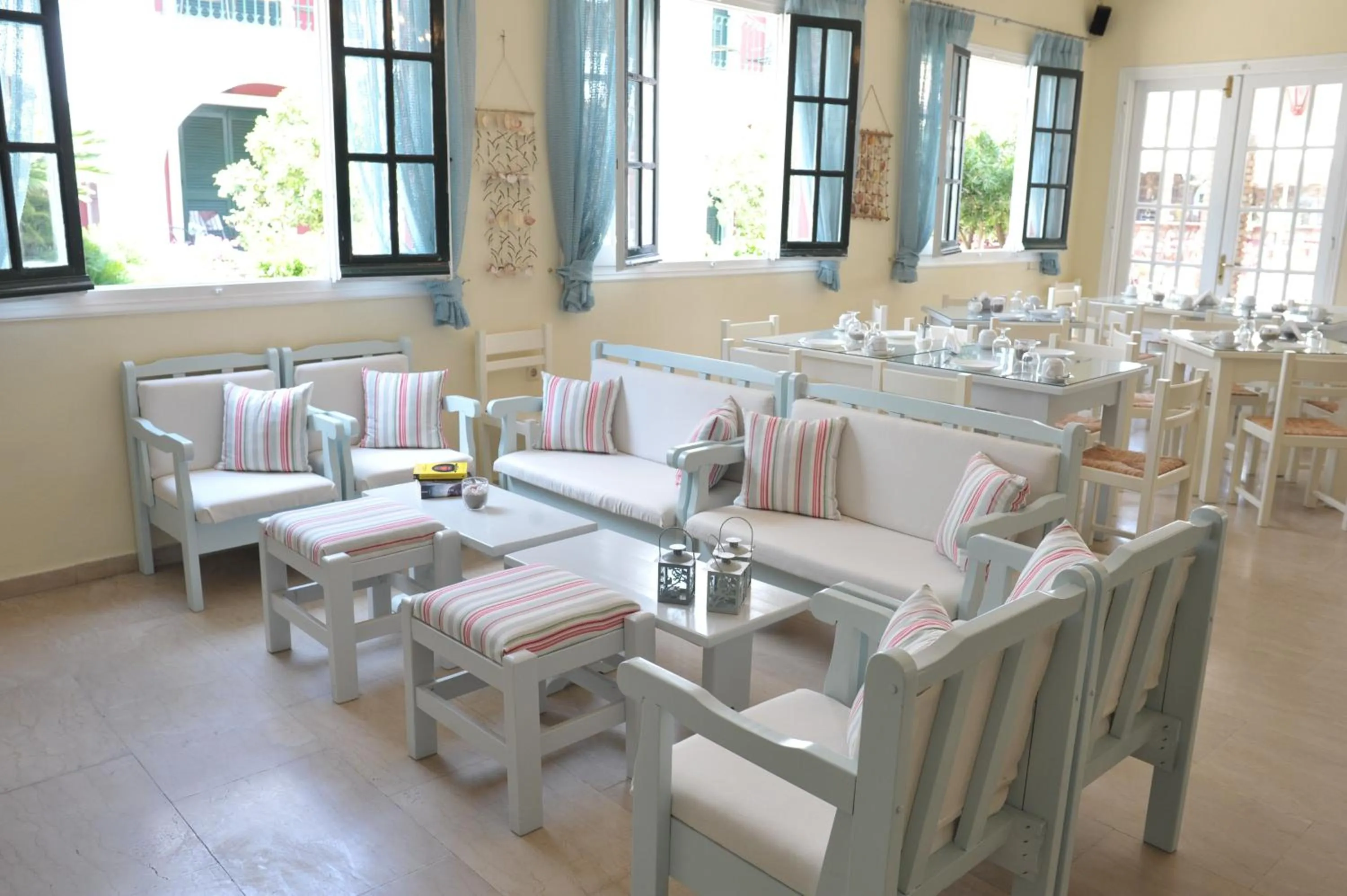 Communal lounge/ TV room in Iliada Beach Hotel