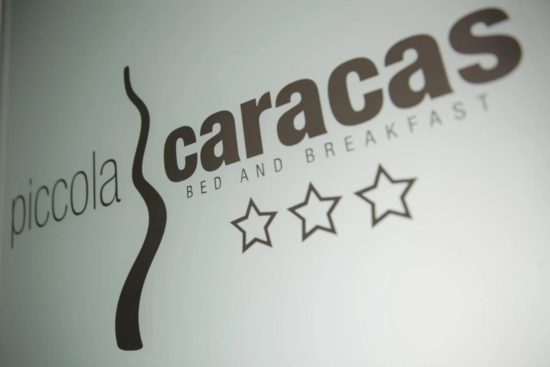 Property logo or sign in Piccola Caracas B&B