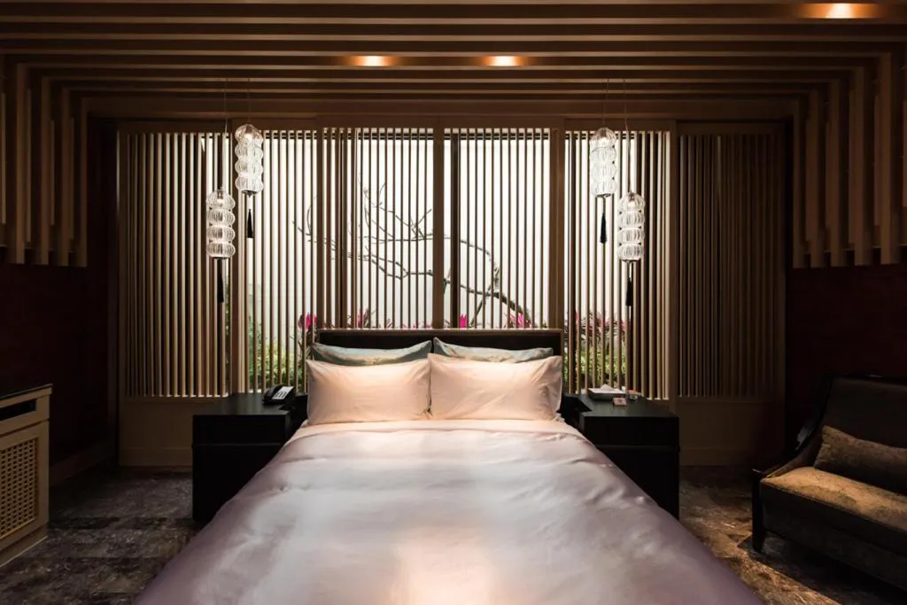 Bed in Green Palm Motel