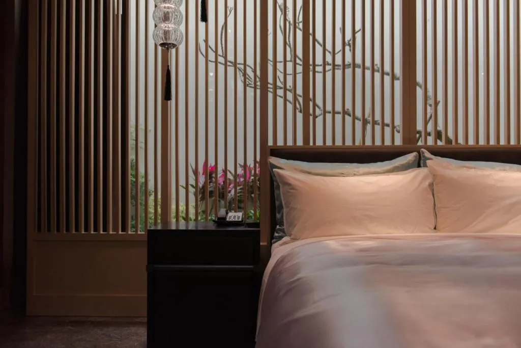 Bed in Green Palm Motel