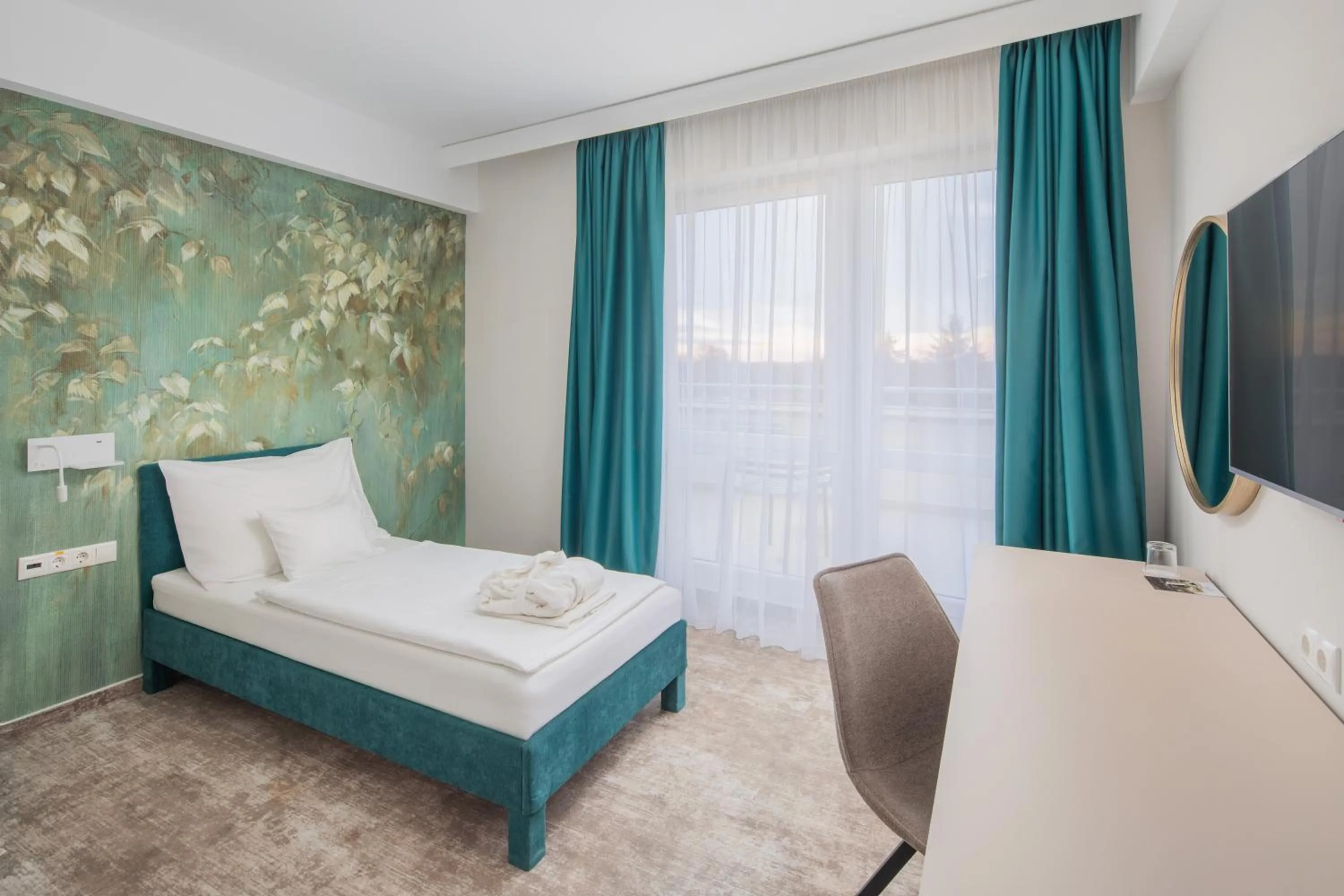 Living room, Bed in Hotel Atlantis Wellness & Conference