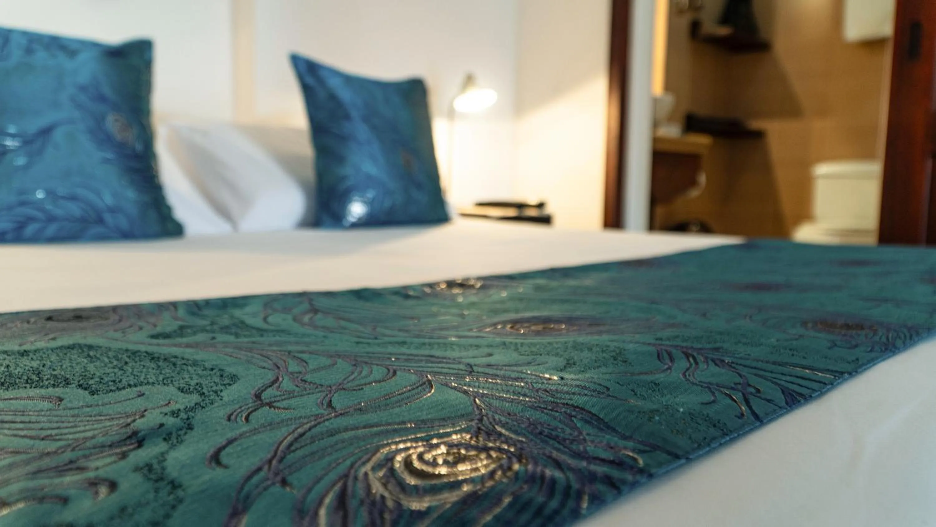 Bed in Hotel Galapagos Suites B&B