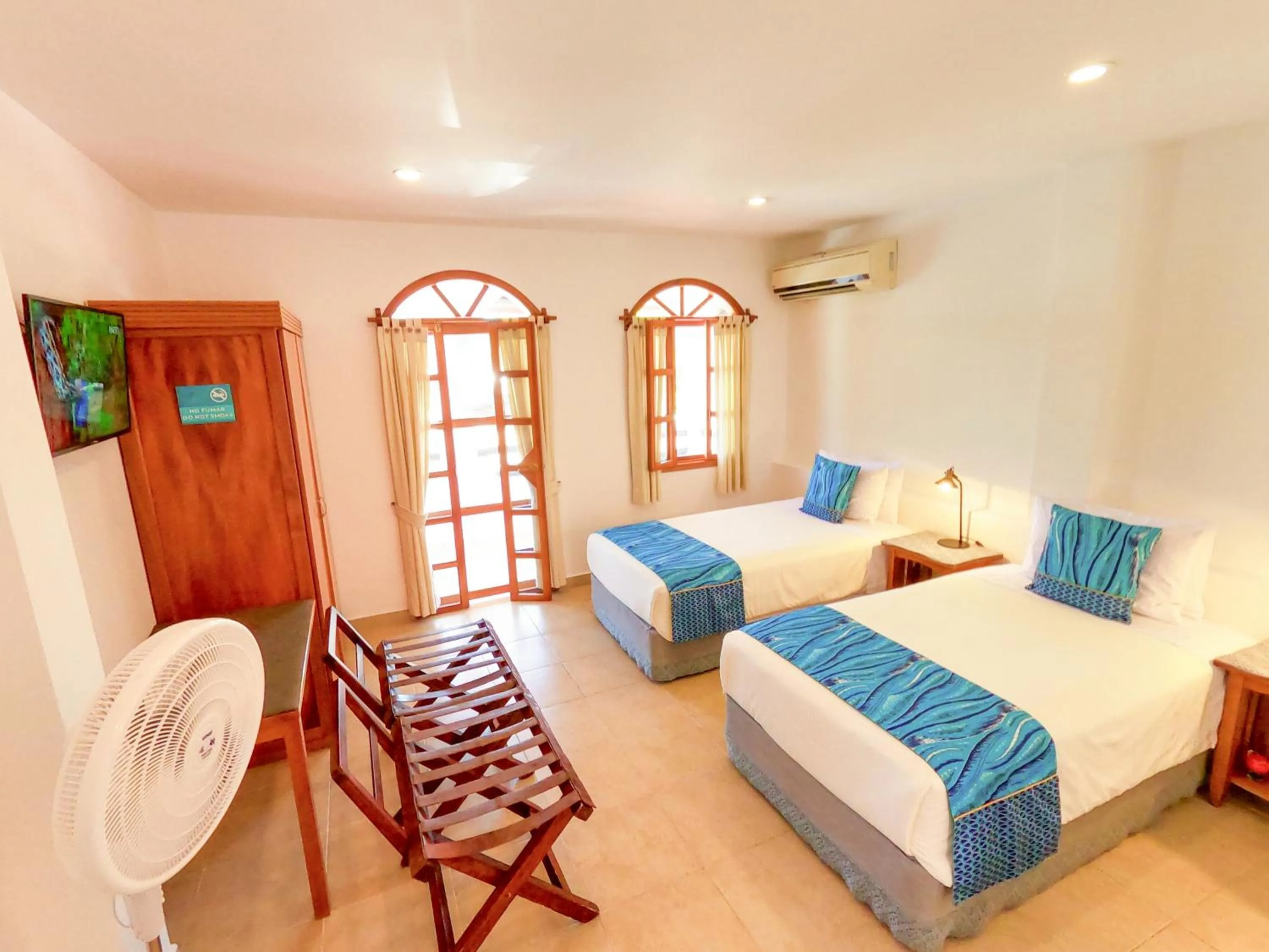 Bed in Hotel Galapagos Suites B&B