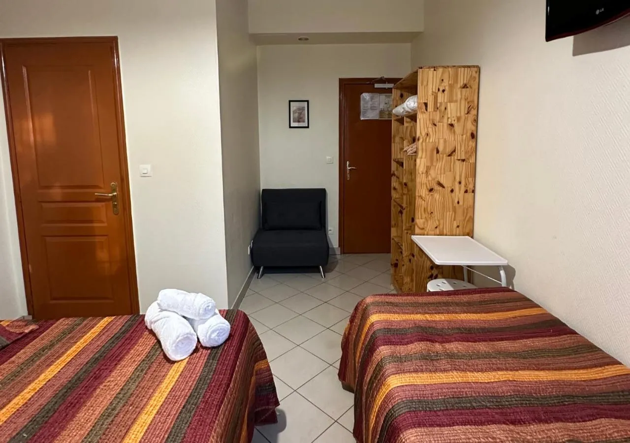 Bed in Hôtel Victor Hugo