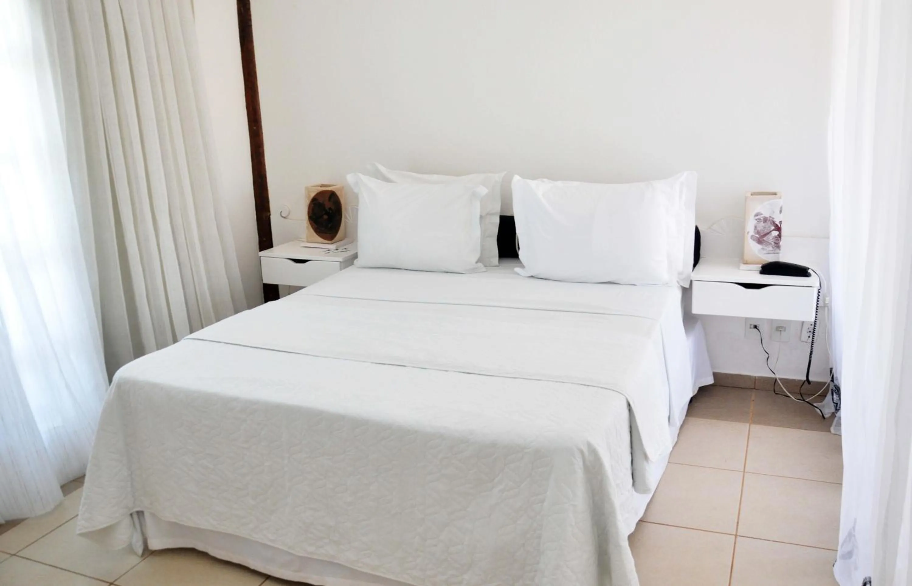 Bed in Bruno Marambaia Charme Hotel