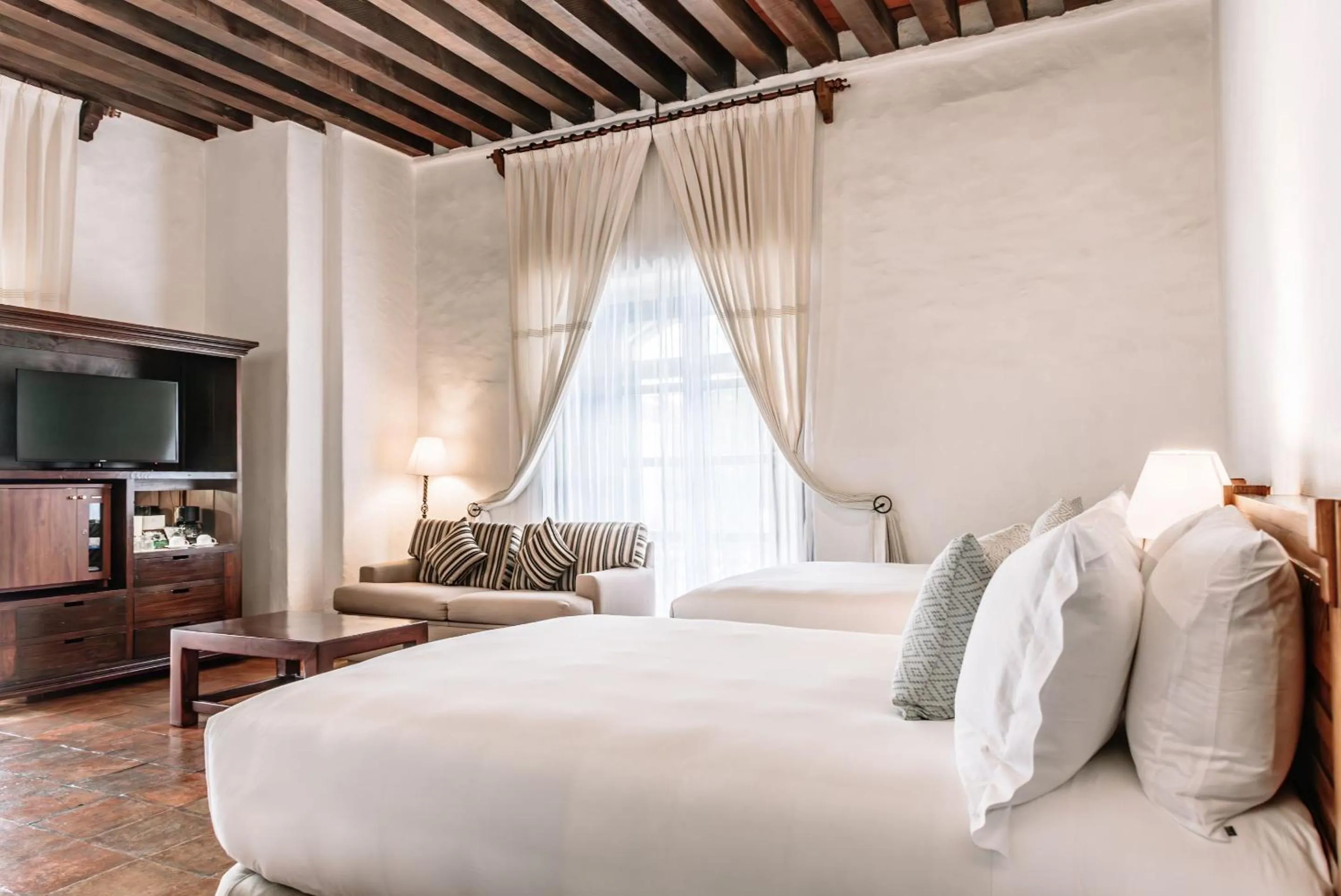 Bedroom, Bed in Quinta Real Oaxaca