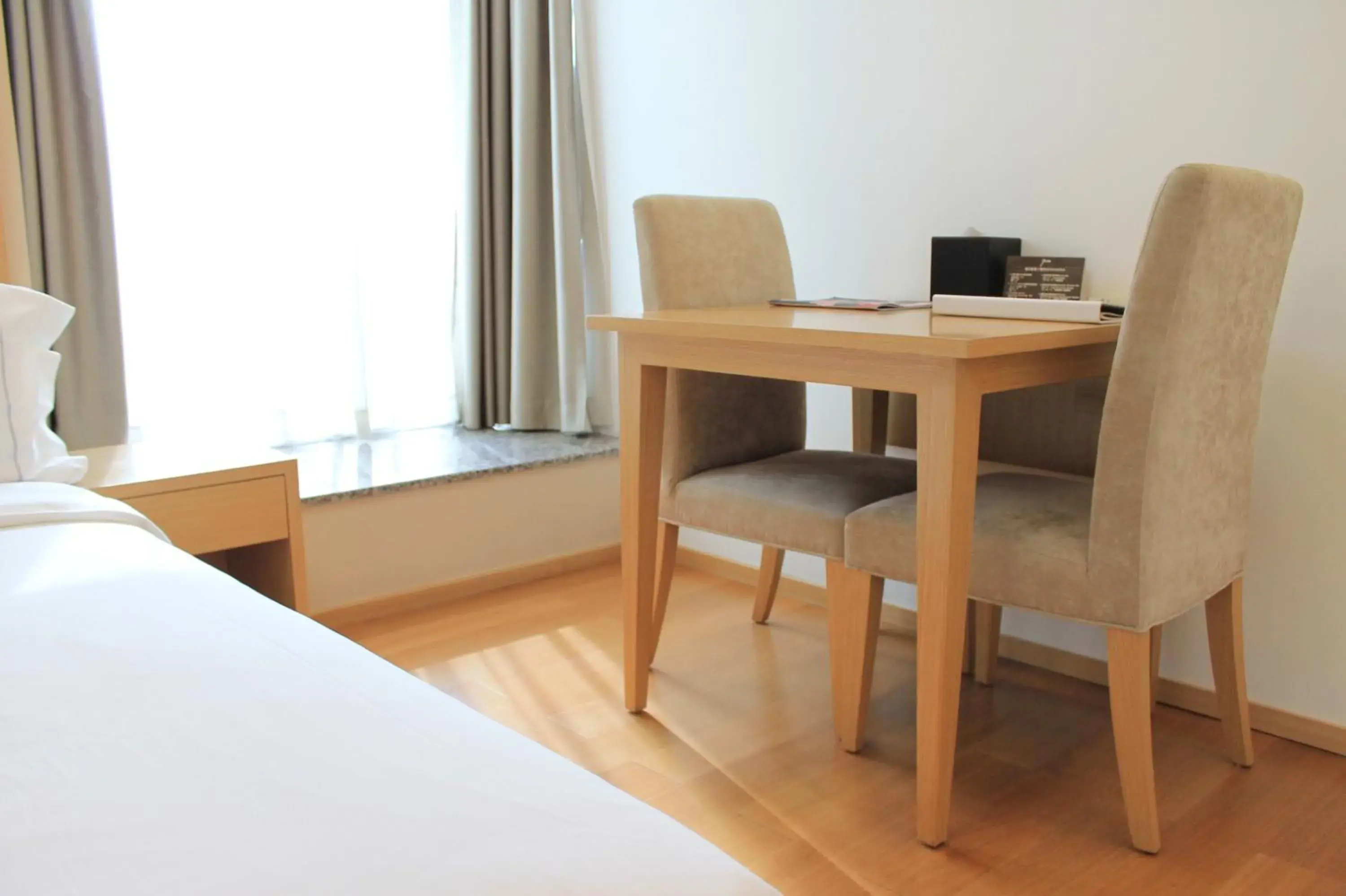 Seating area, Bed in Yuwa Hotel