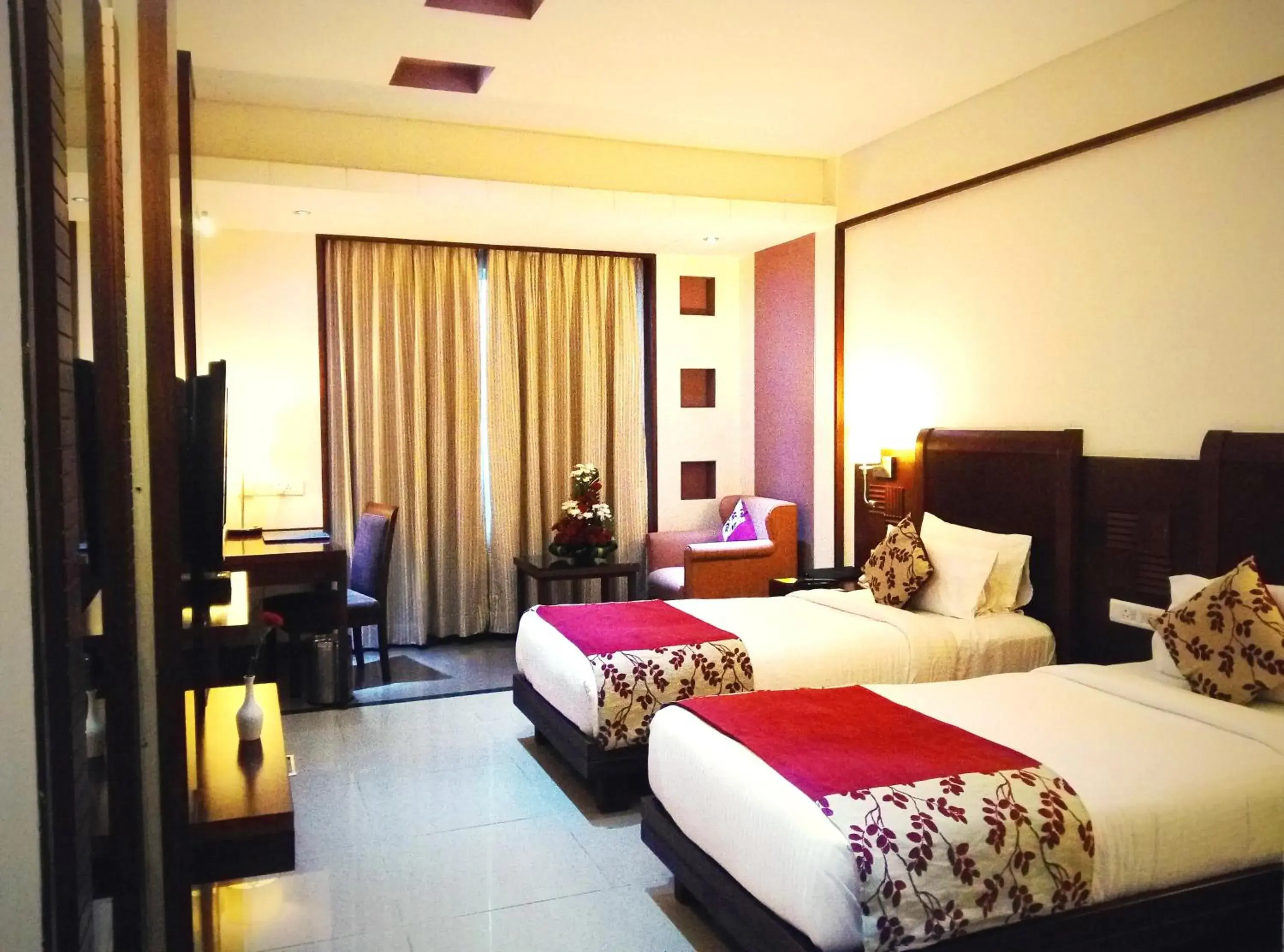 TV and multimedia, Bed in Royal Orchid Central, Shimoga TV and multimedia, Bed in Royal Orchid Central, Shimoga