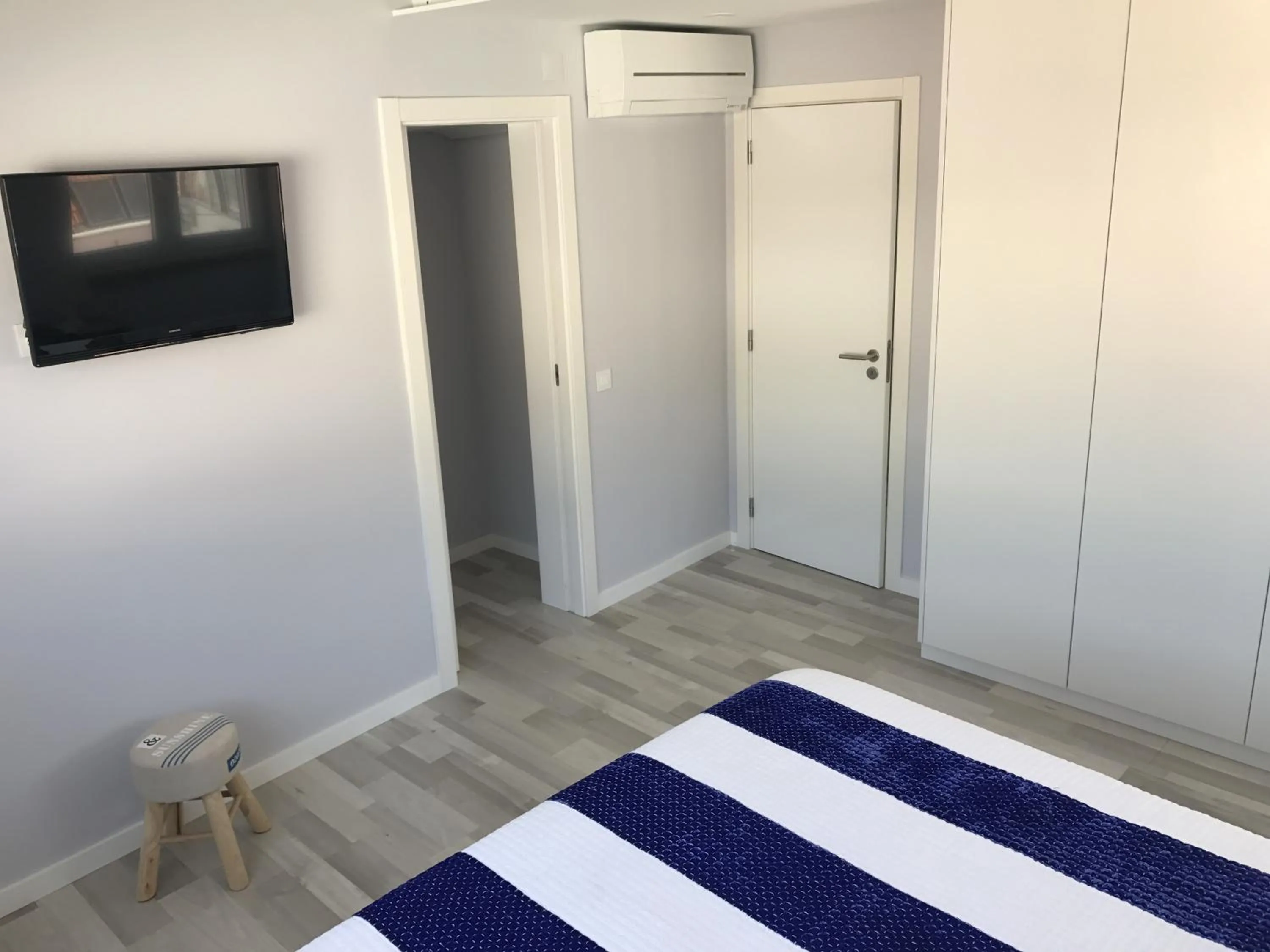 Bed in Blue Bay Beach Apartment