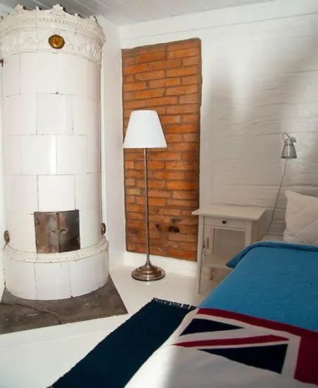 Photo of the whole room, Bed in Johanssons Gårdshotell i Roslagen