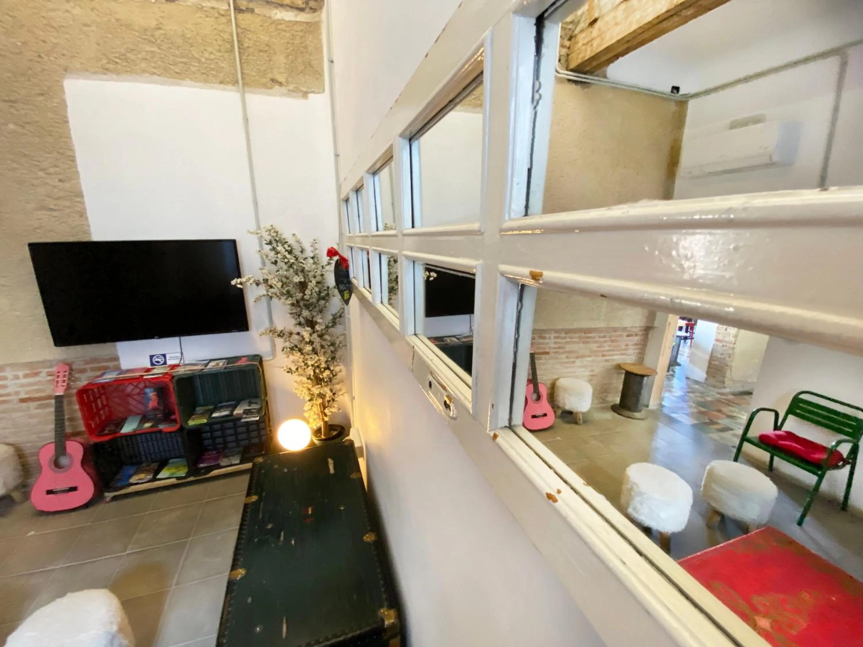 Communal lounge/ TV room in ECO Hostel