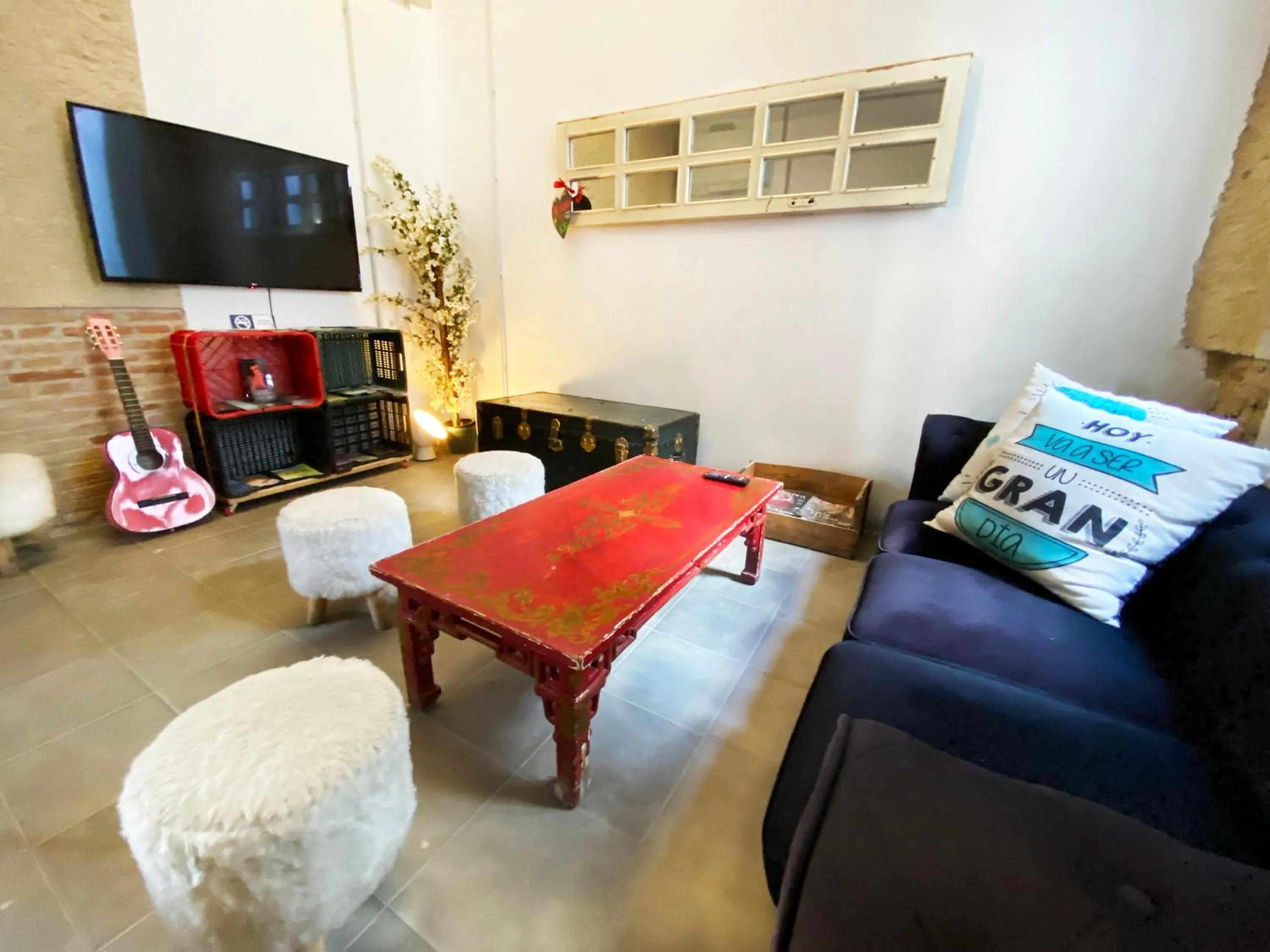 Communal lounge/ TV room in ECO Hostel