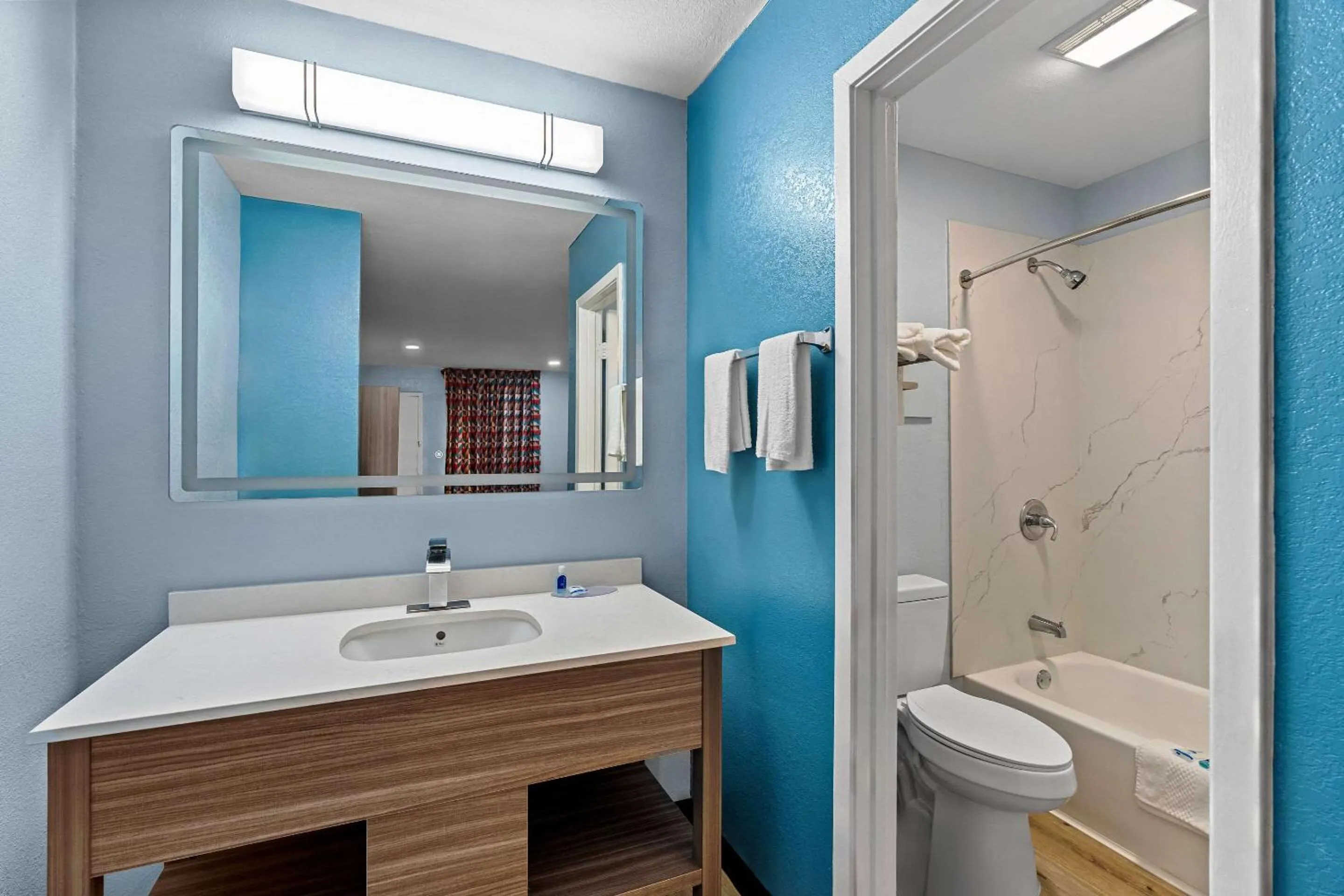 Bedroom in Rodeway Inn & Suites