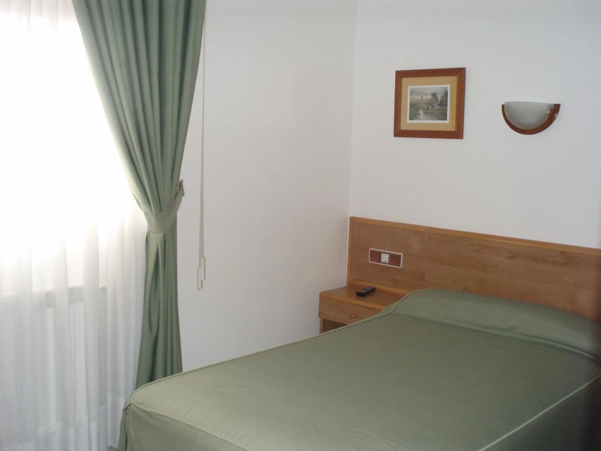 Bed in Hotel Paraimo