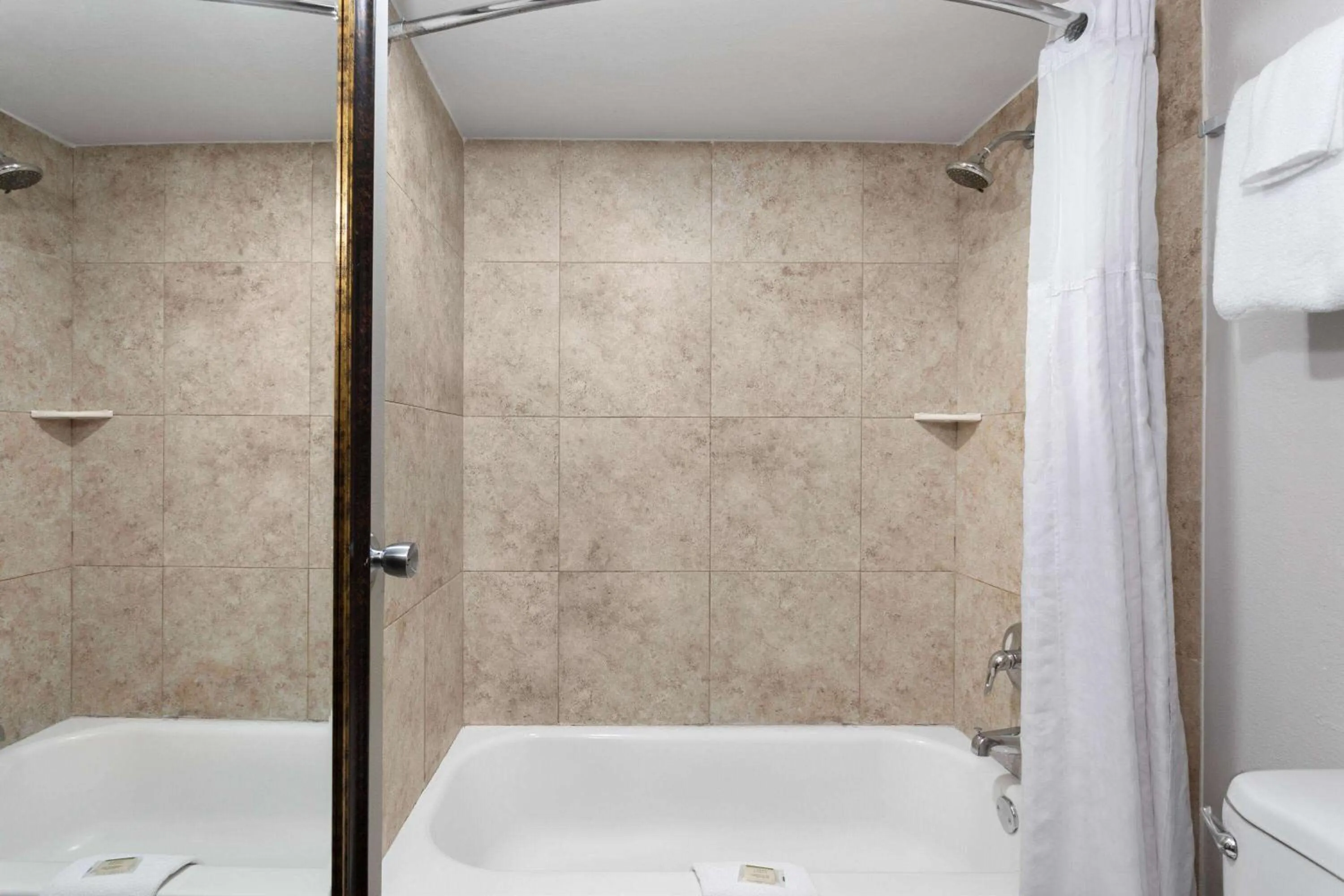 Bathroom in Days Inn by Wyndham Wildwood I-75