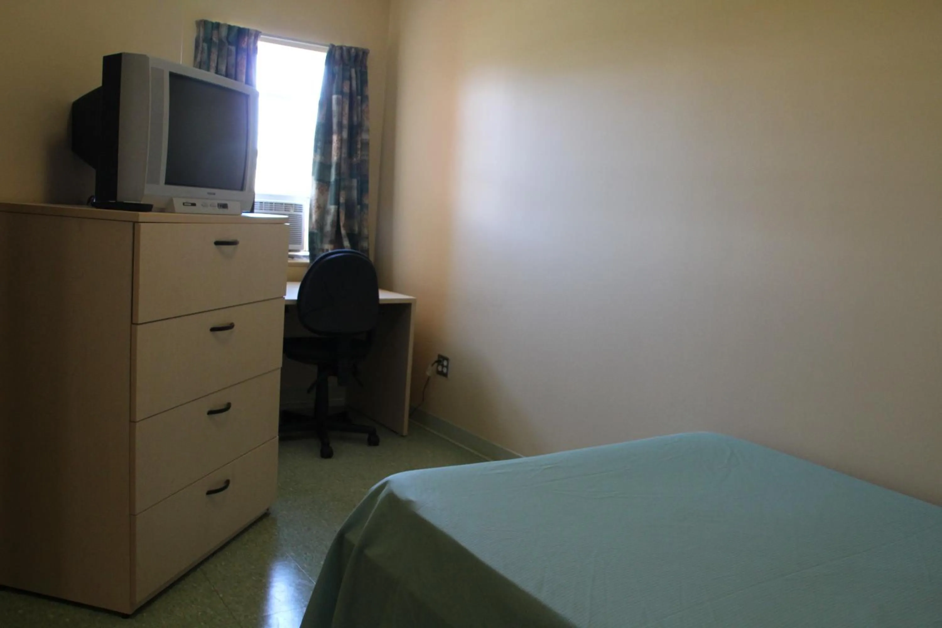 Bed in Glendenning Hall at Holland College
