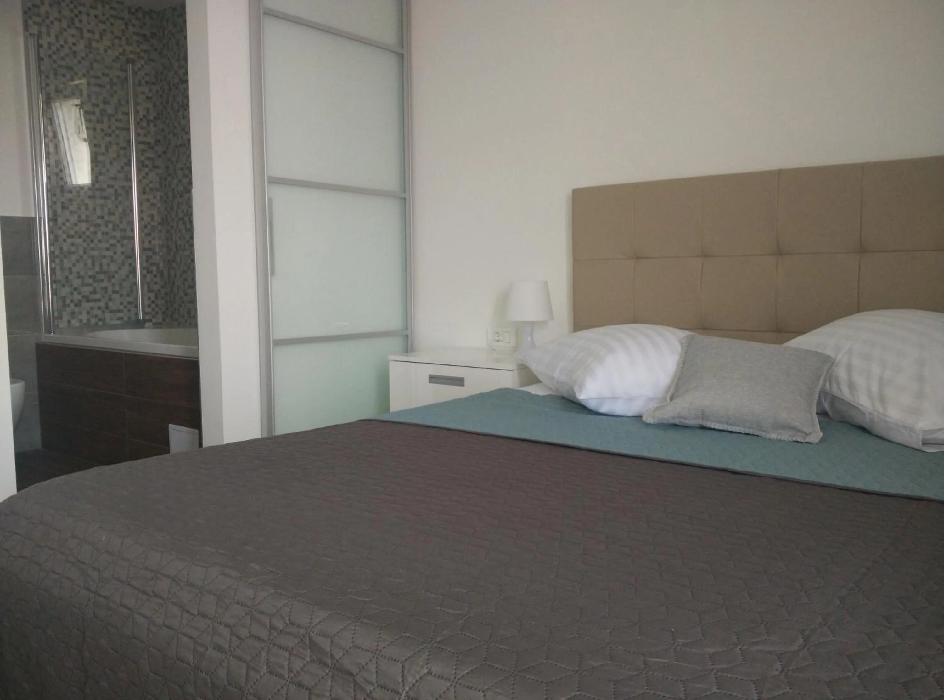 Bathroom, Bed in Apartments Gina