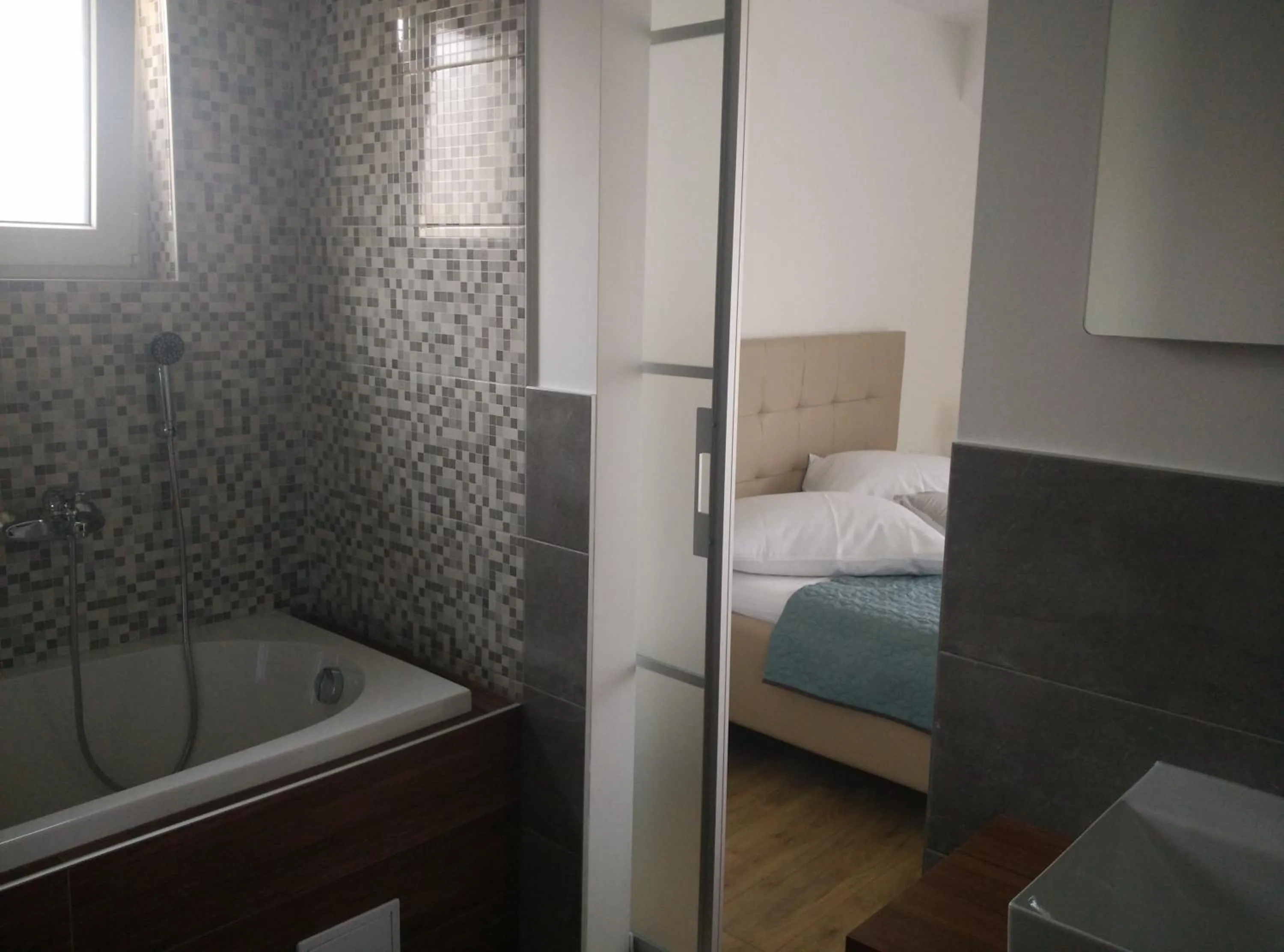 Bathroom, Bed in Apartments Gina