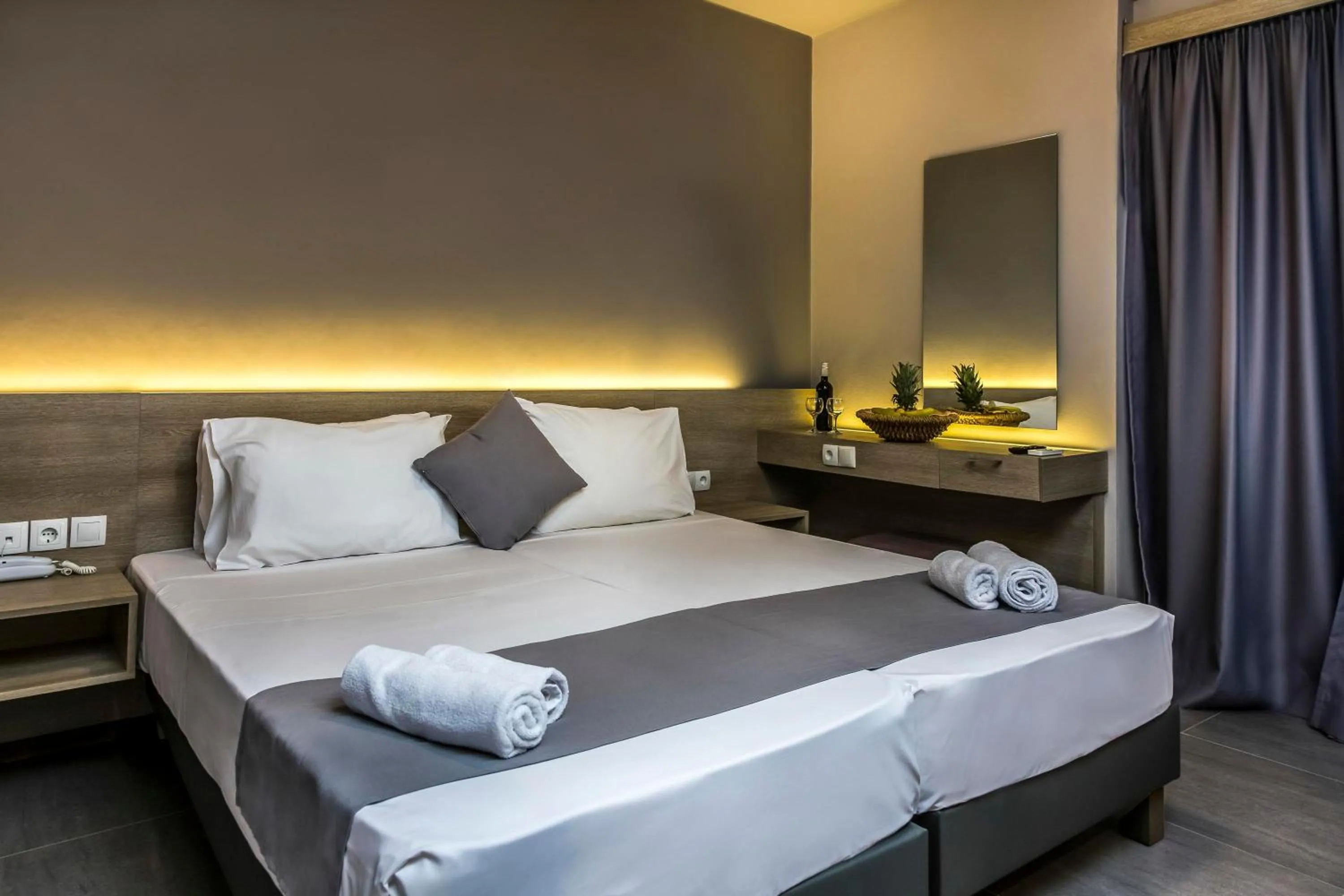 Bed in Elmi Beach Hotel & Suites