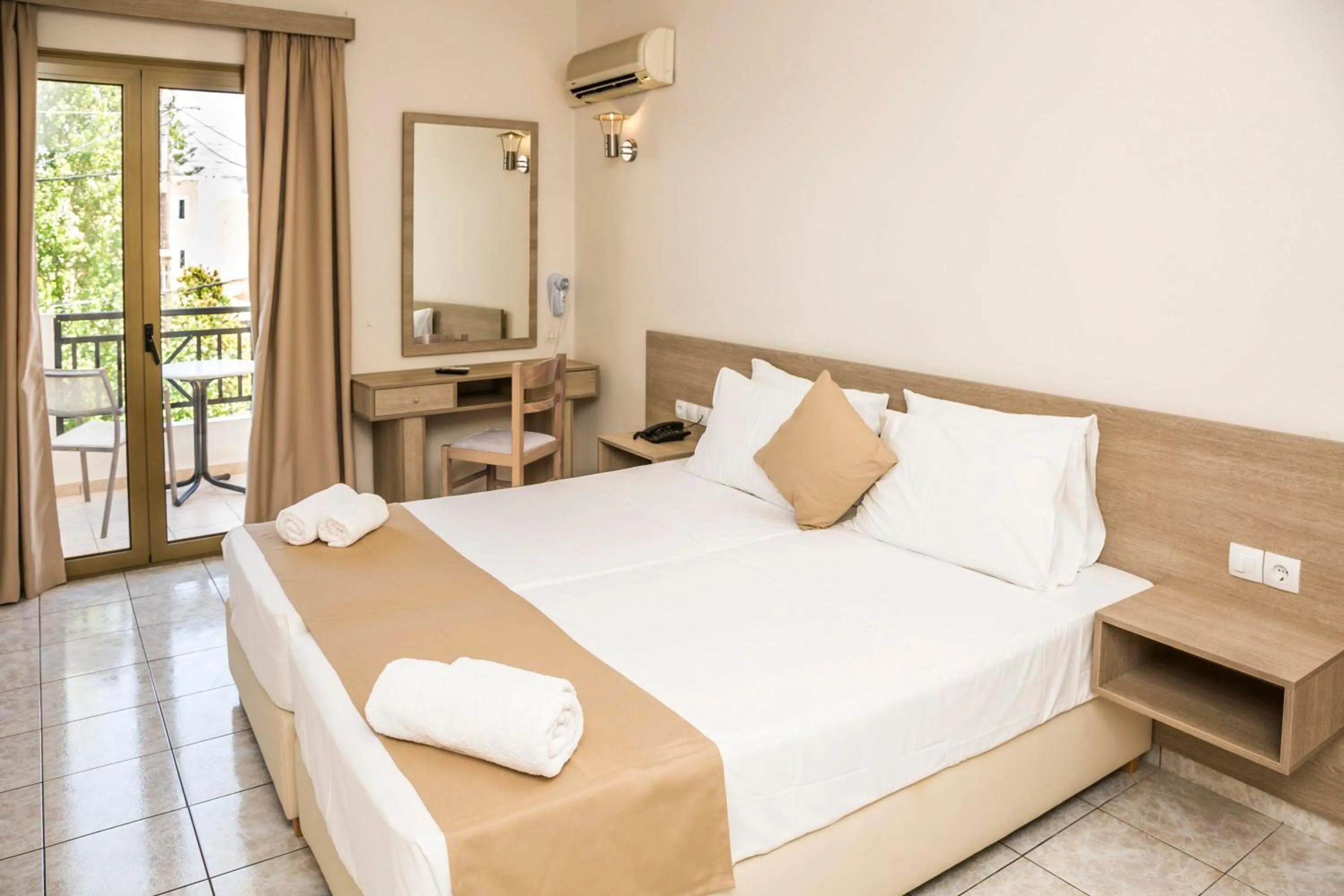 Bed in Elmi Beach Hotel & Suites