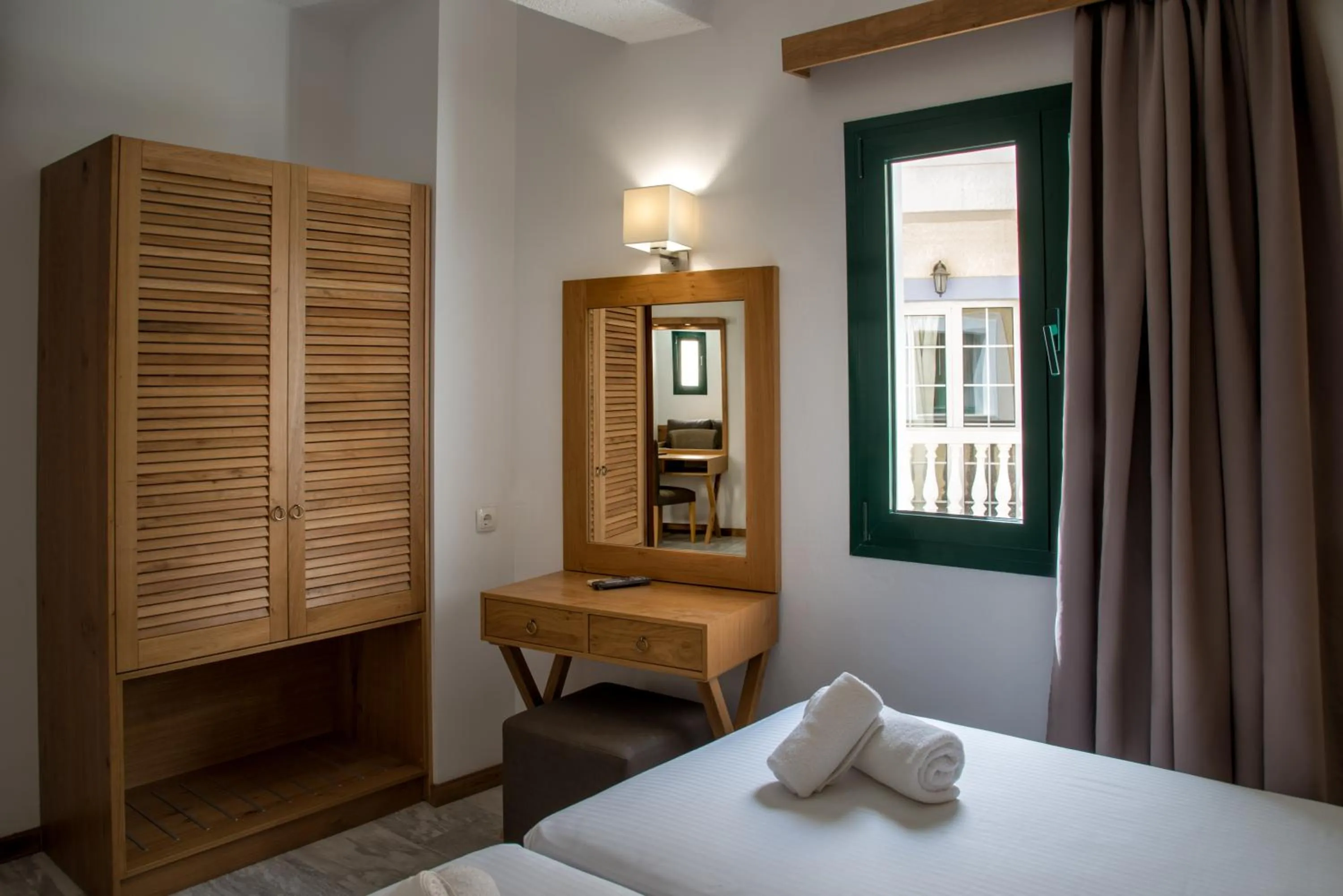 Bed in Elmi Beach Hotel & Suites