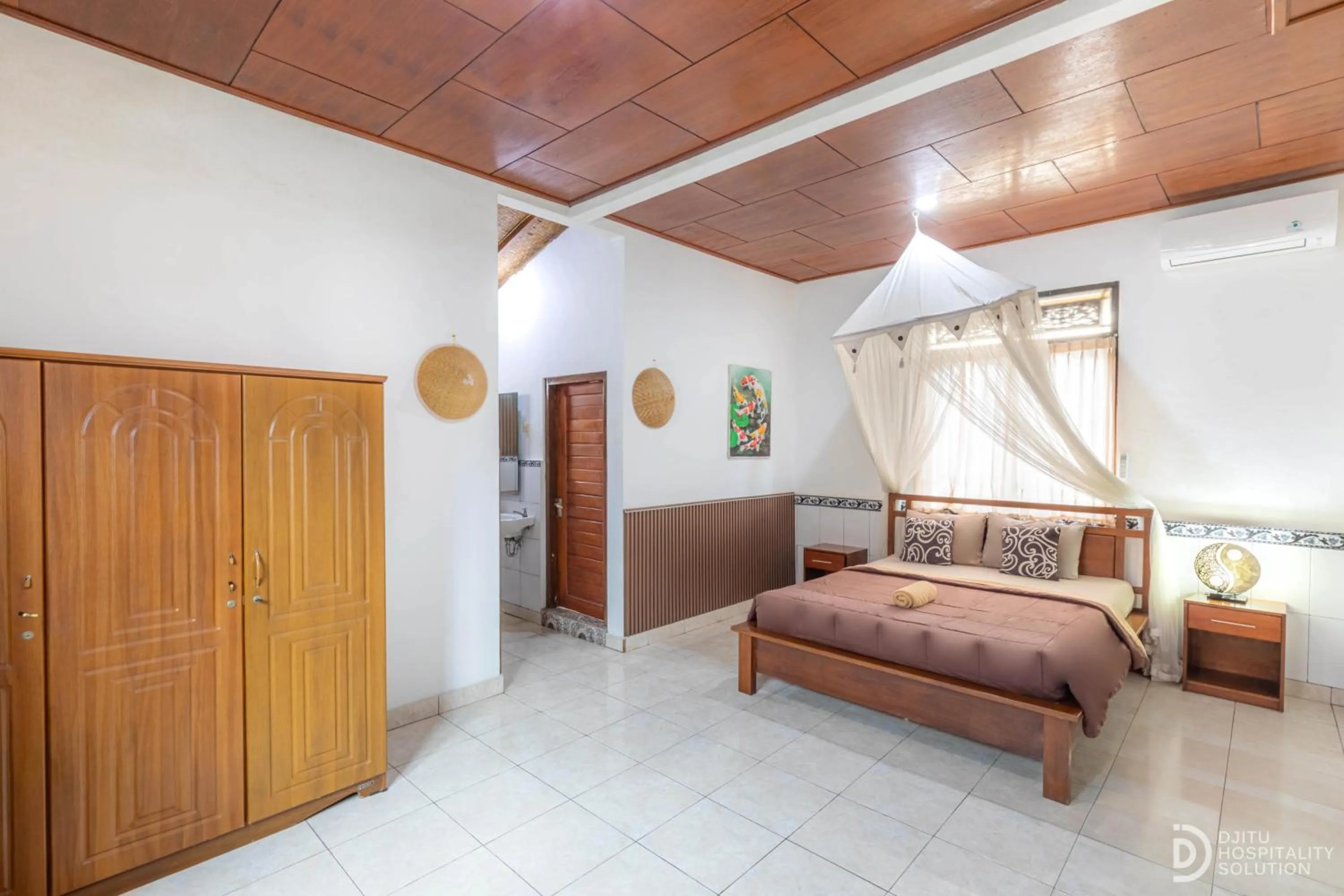 Bed in Artha Dewata Home Stay