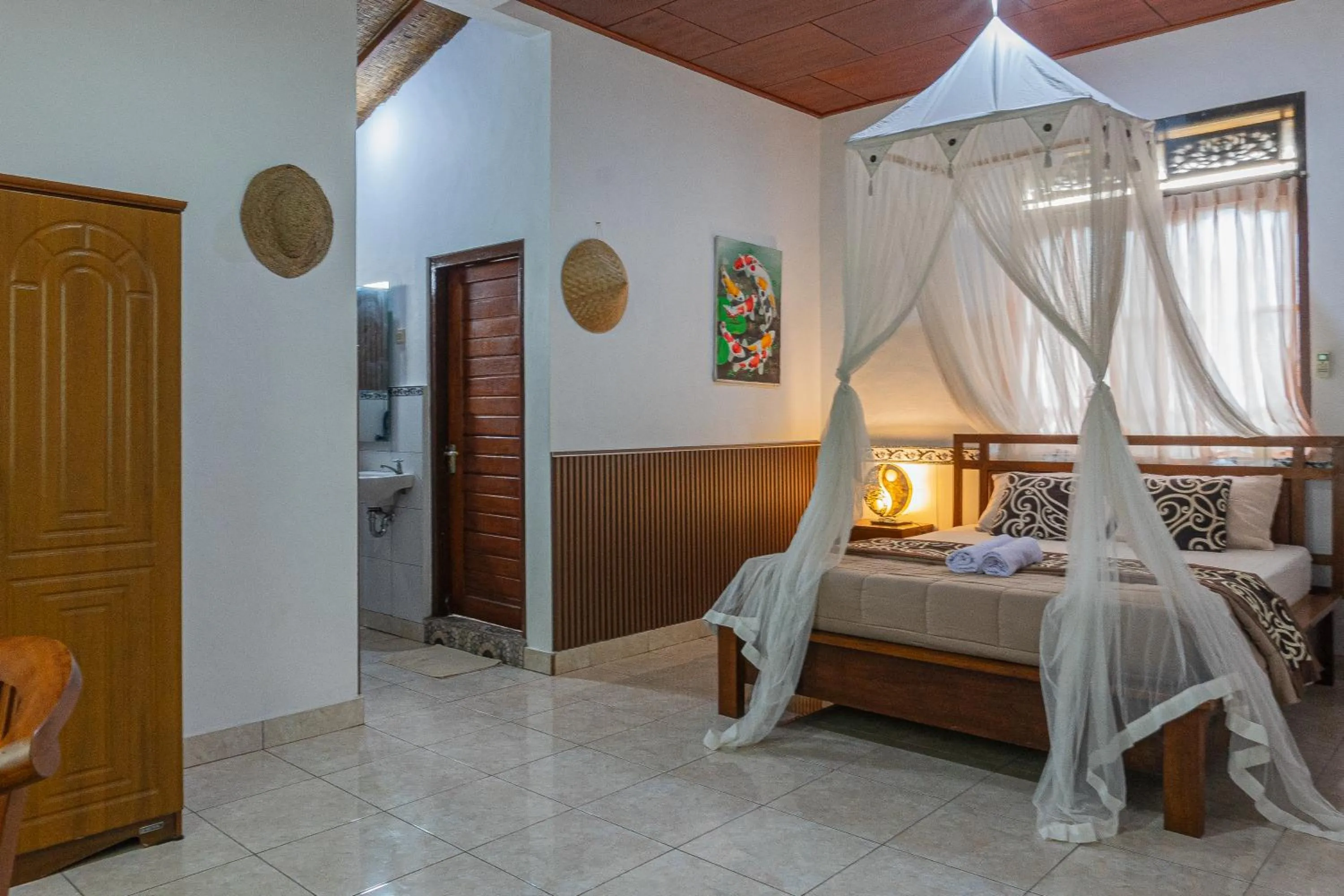 Bed in Artha Dewata Home Stay