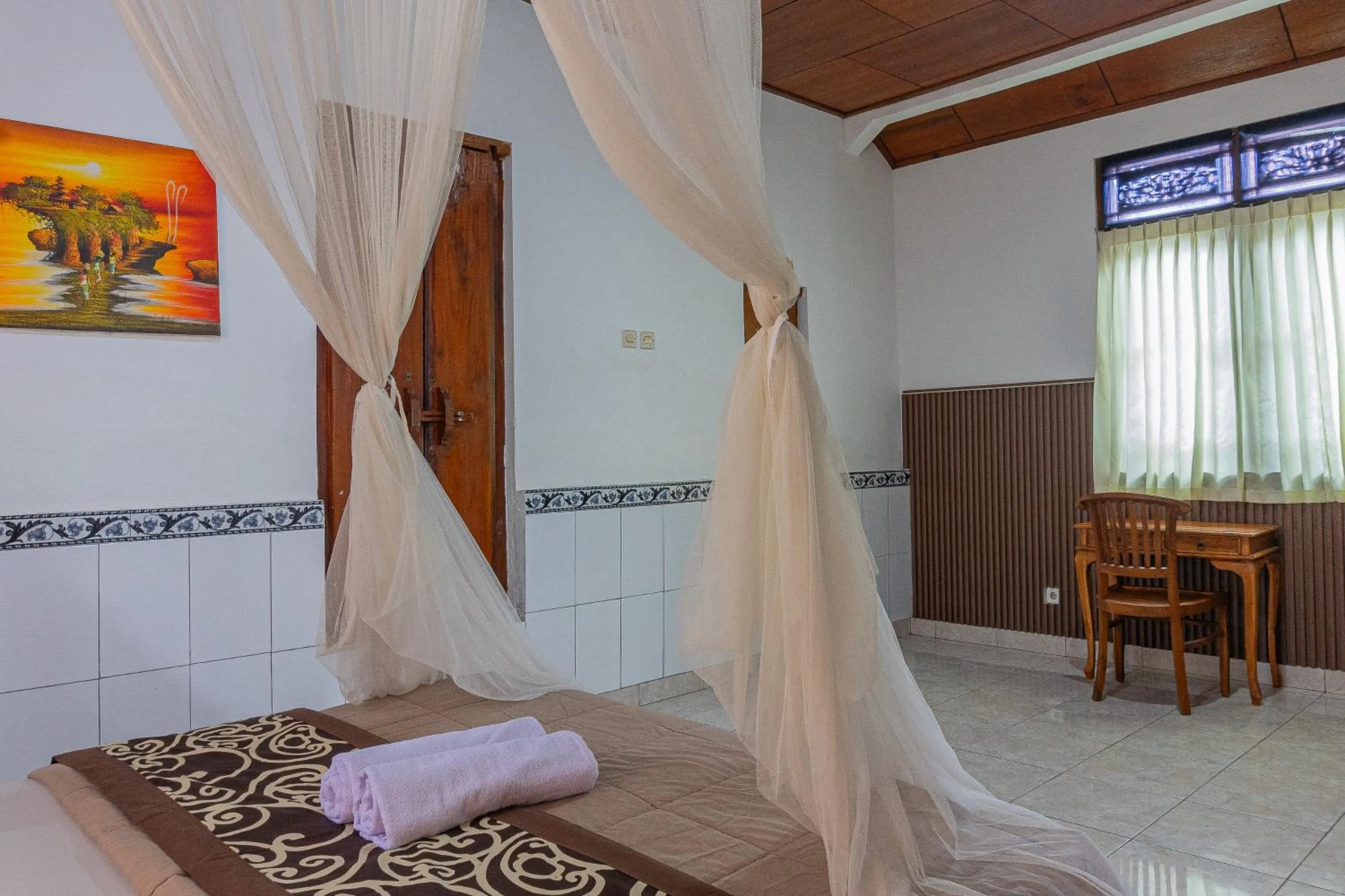 Bed in Artha Dewata Home Stay