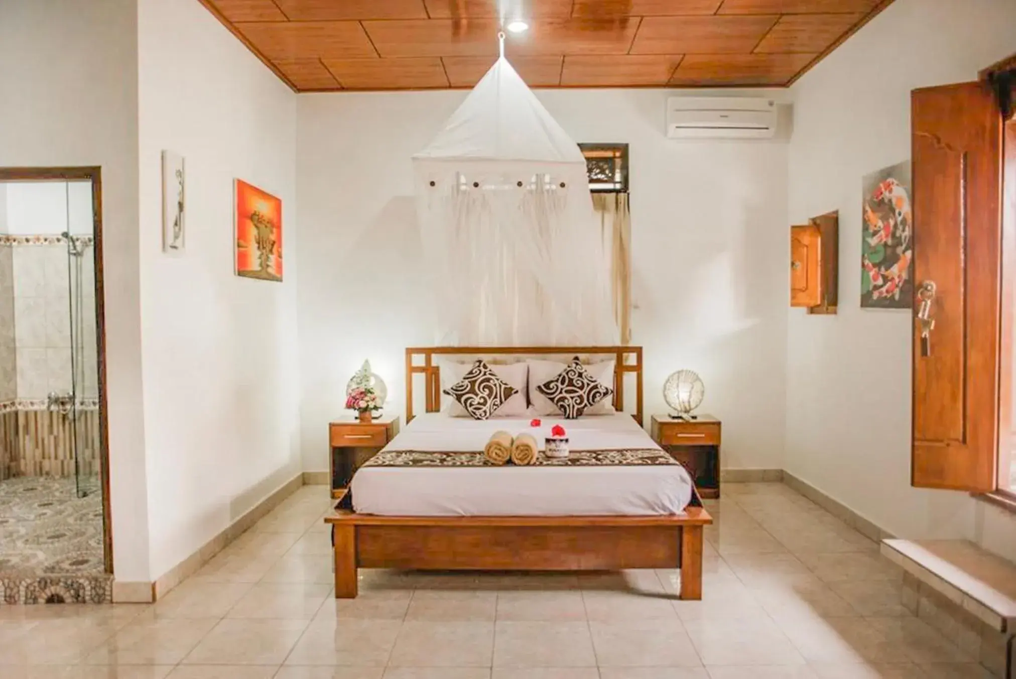 Bed in Artha Dewata Home Stay Bed in Artha Dewata Home Stay