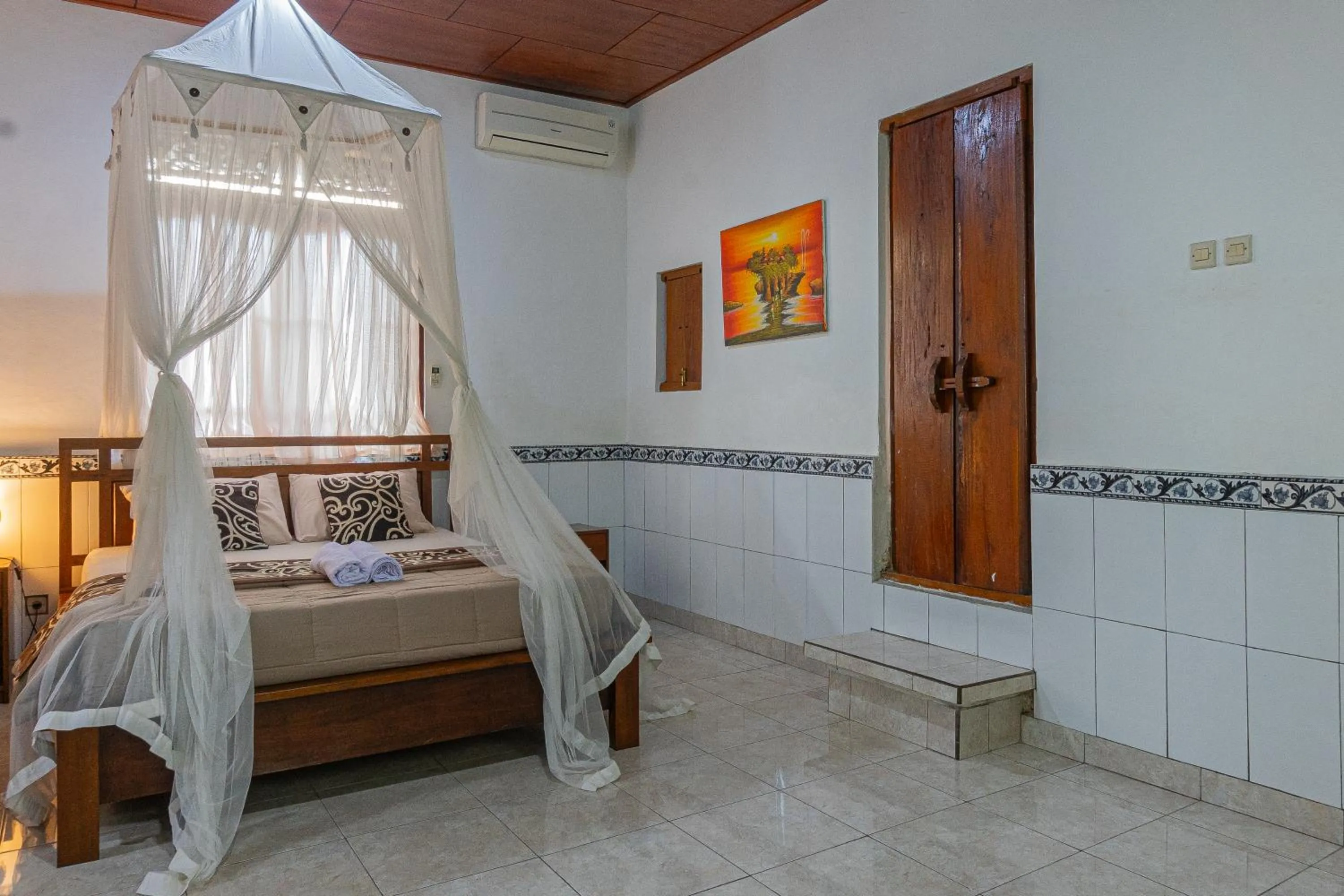 Bed in Artha Dewata Home Stay