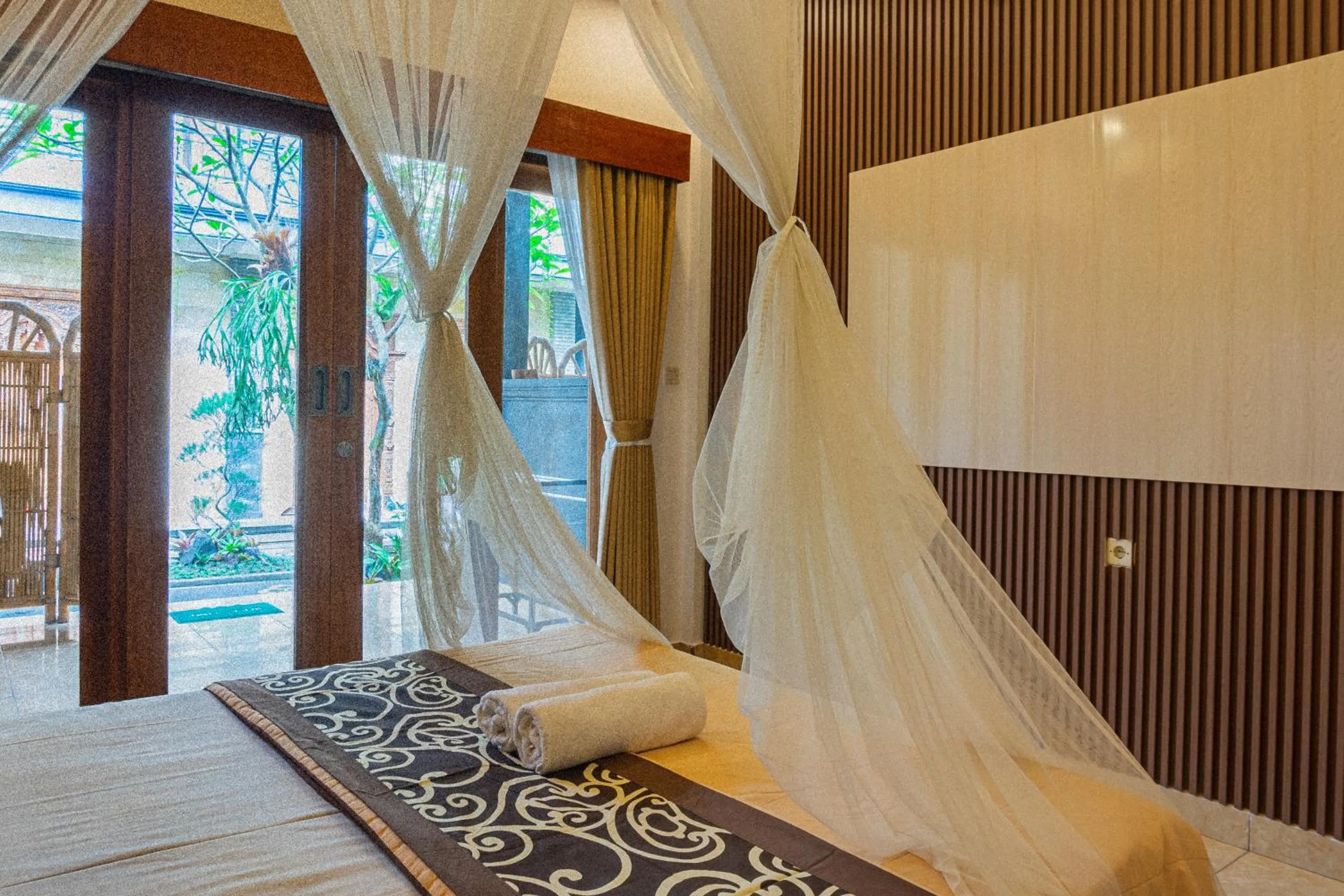 Bed in Artha Dewata Home Stay