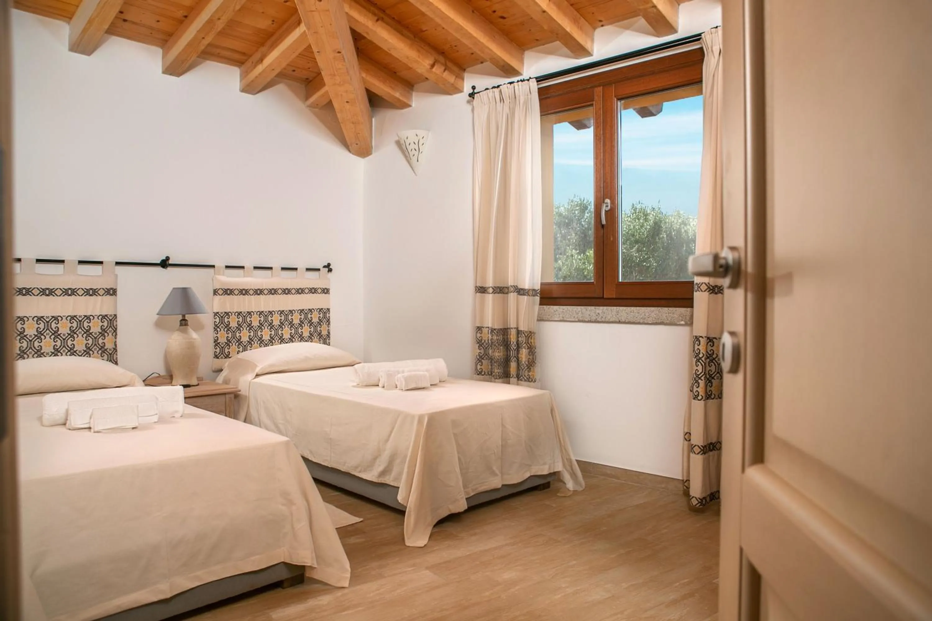 Bedroom, Bed in Punta Falcone Resort