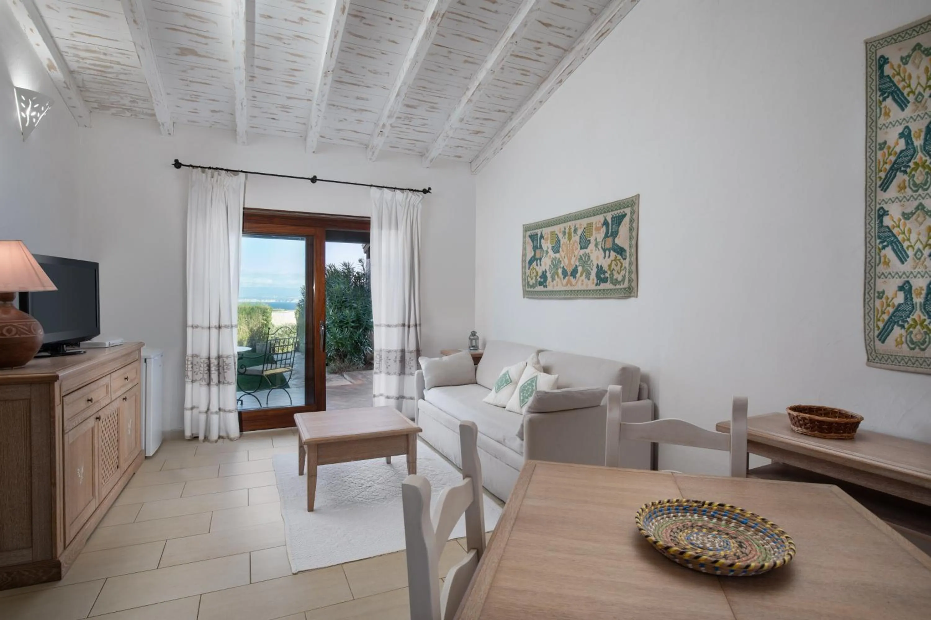 Living room in Punta Falcone Resort