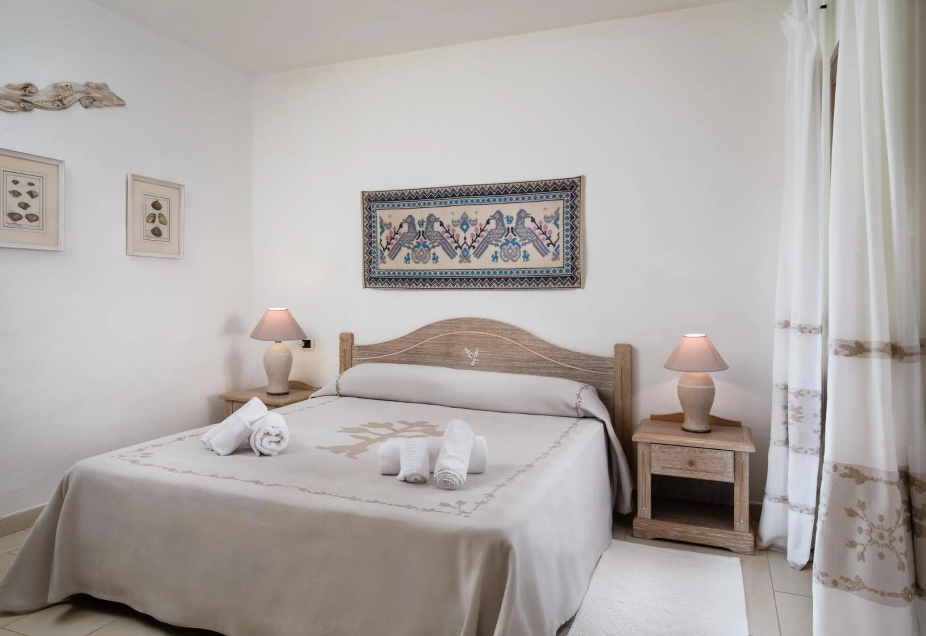 Photo of the whole room, Bed in Punta Falcone Resort