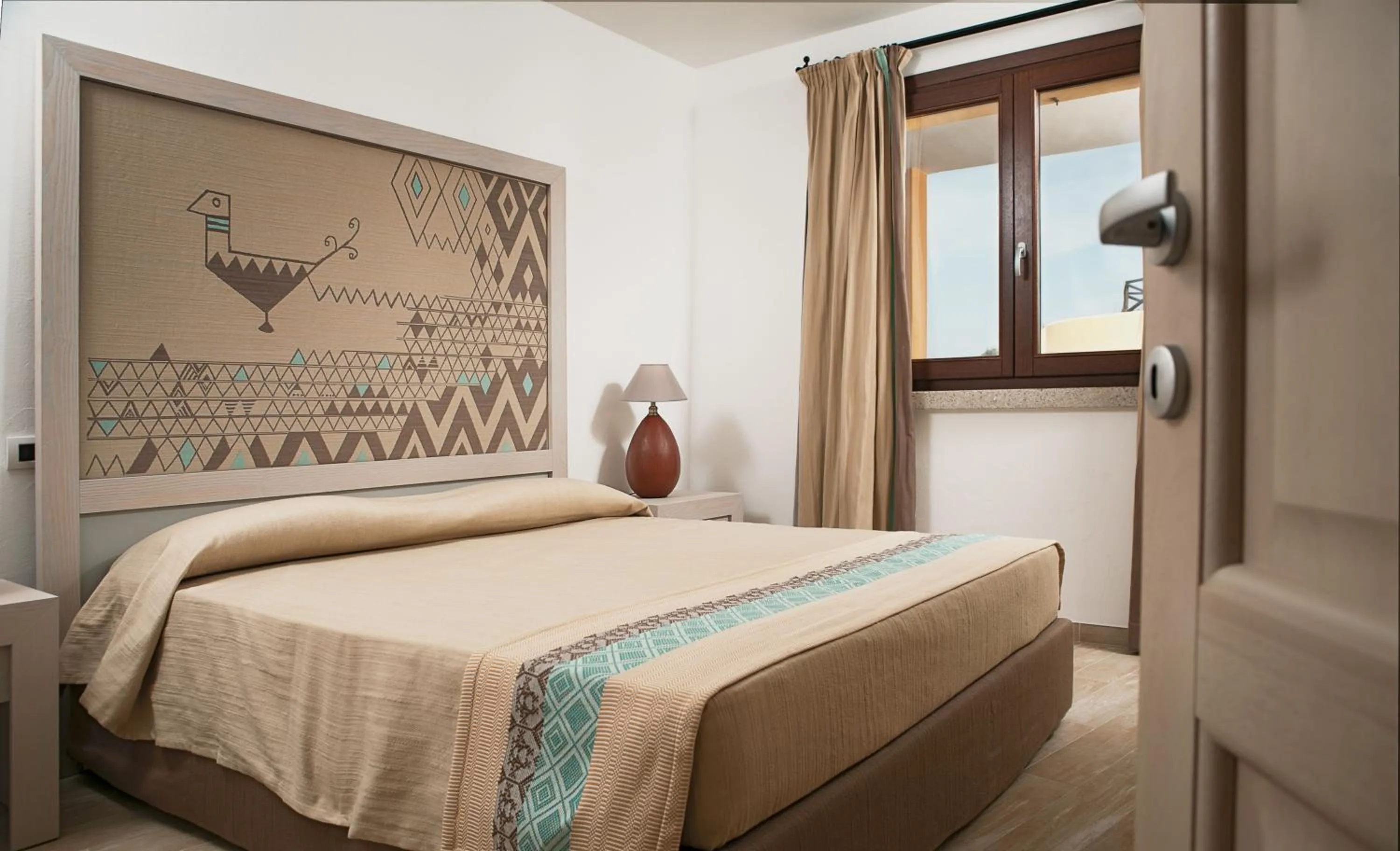 Photo of the whole room, Bed in Punta Falcone Resort