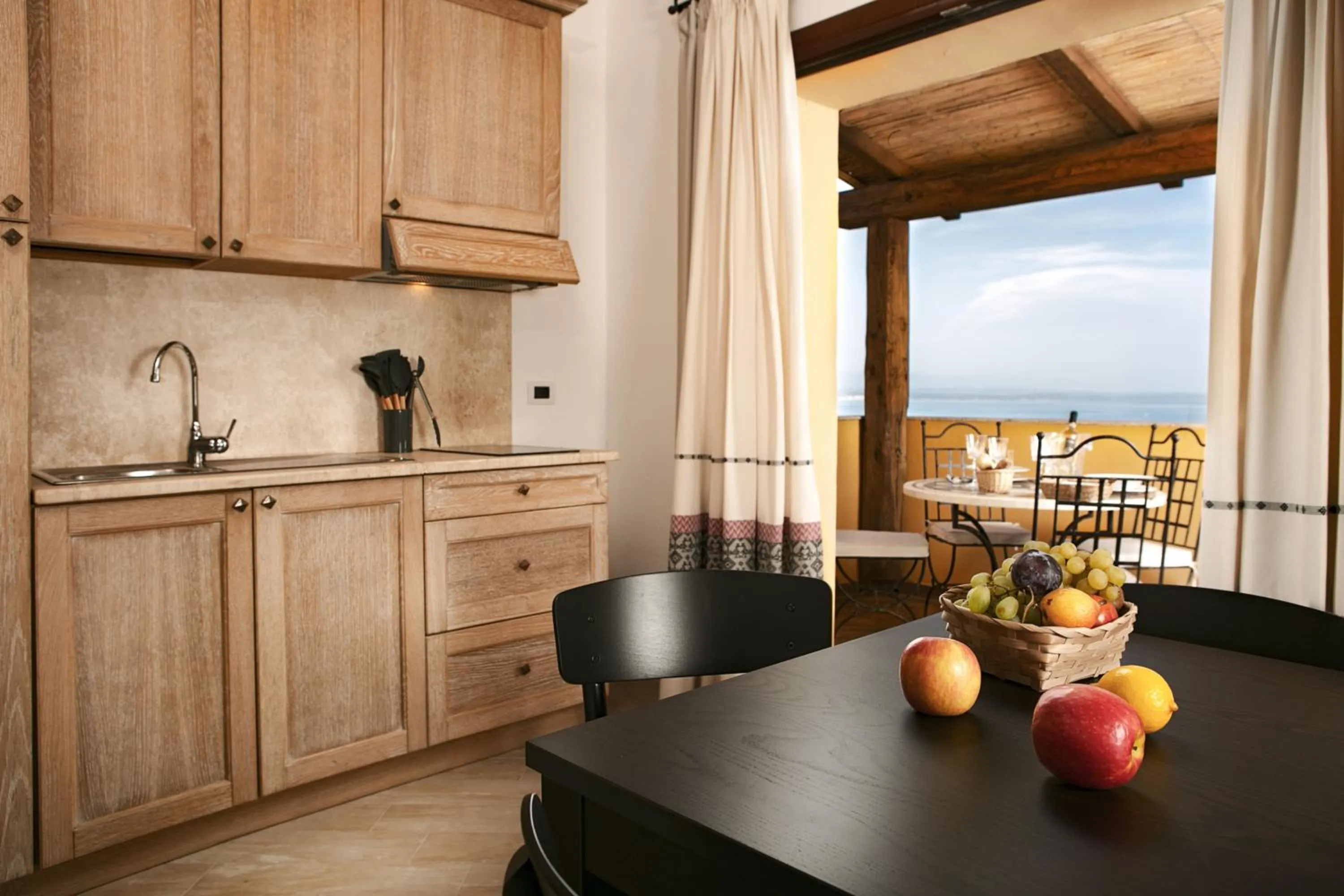 Kitchen or kitchenette in Punta Falcone Resort