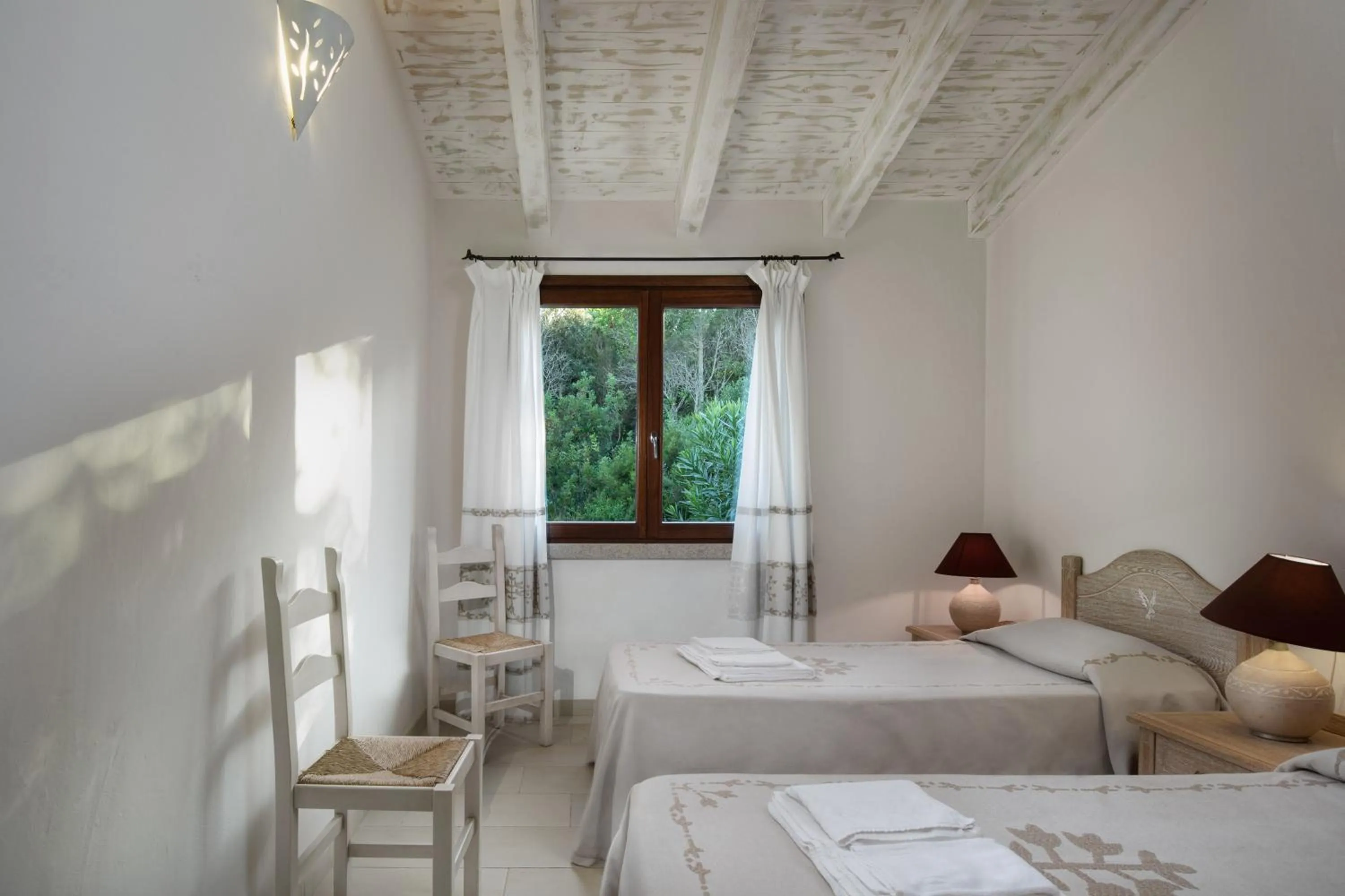 Photo of the whole room, Bed in Punta Falcone Resort