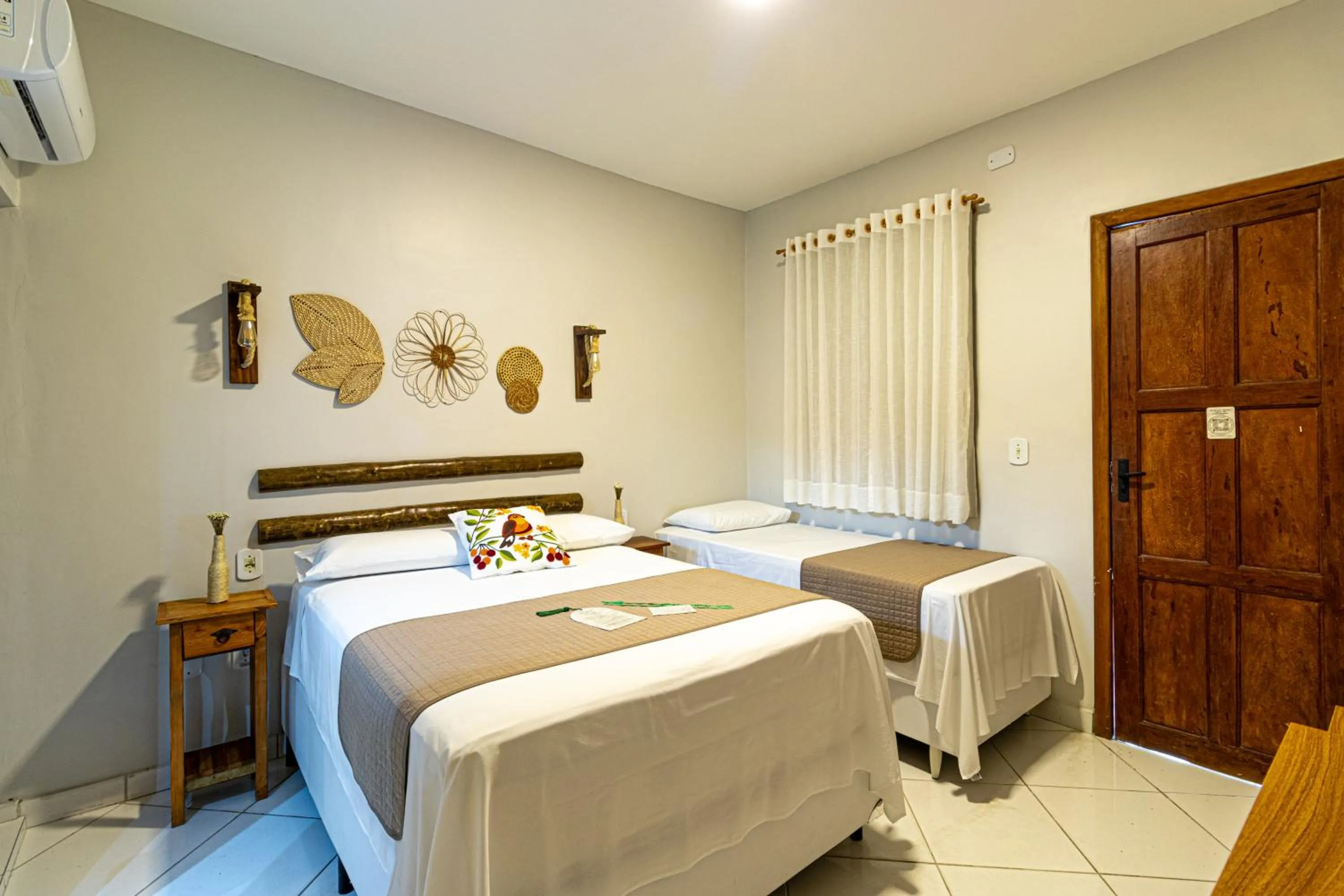 Bed in Pousada Encantos de Arraial