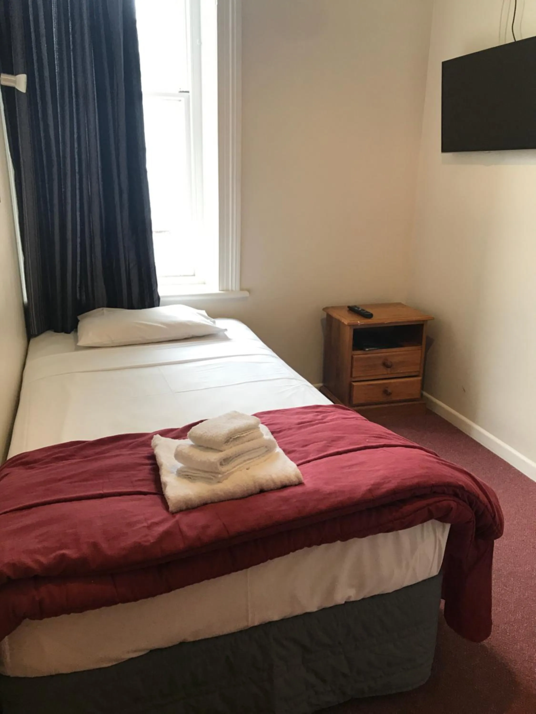 Bed in Criterion Club Hotel