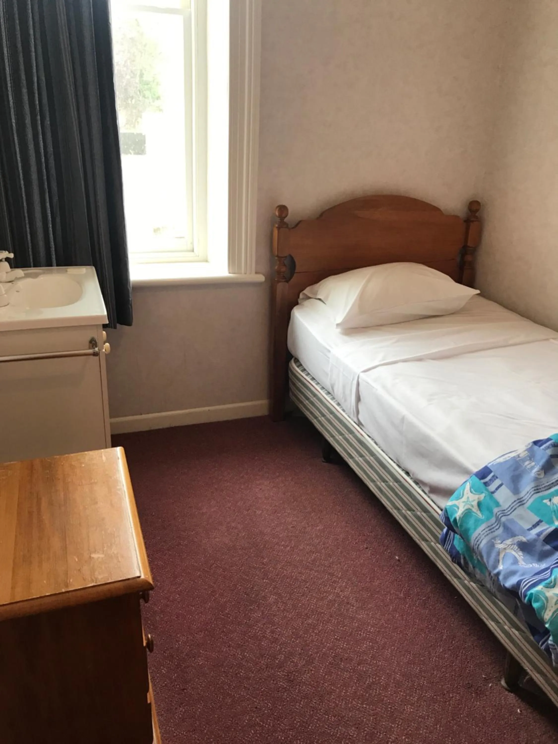 Bed in Criterion Club Hotel