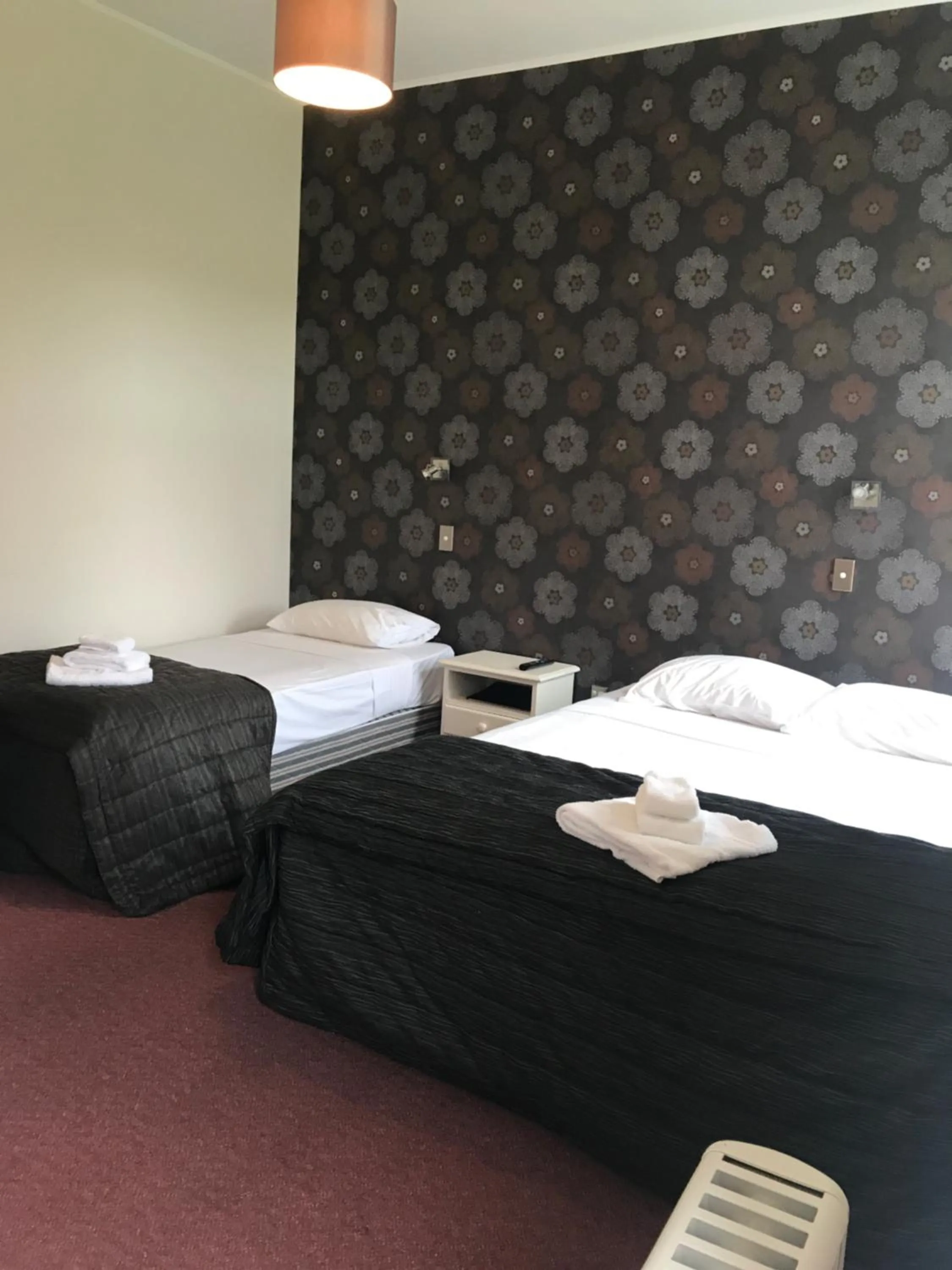 Bed in Criterion Club Hotel