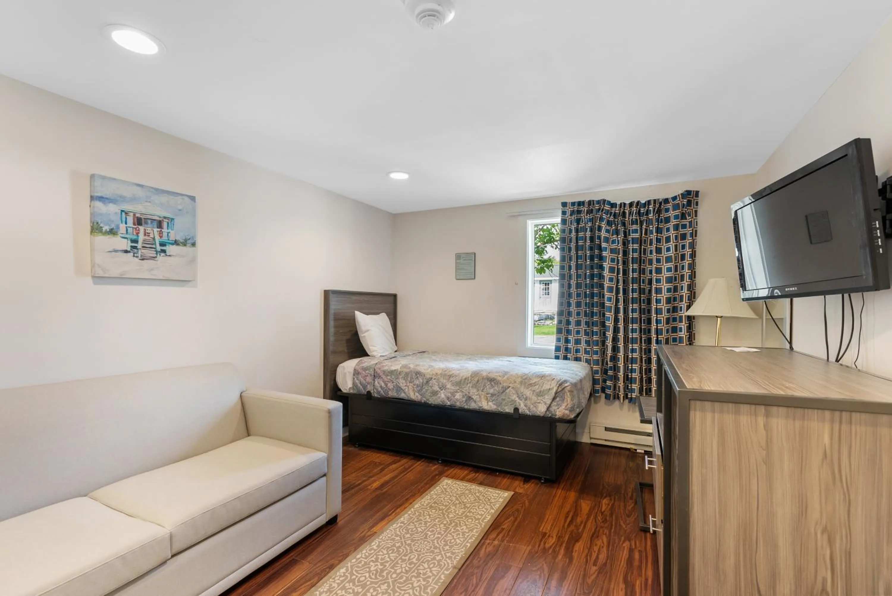 Bed in Ne'r Beach Motel