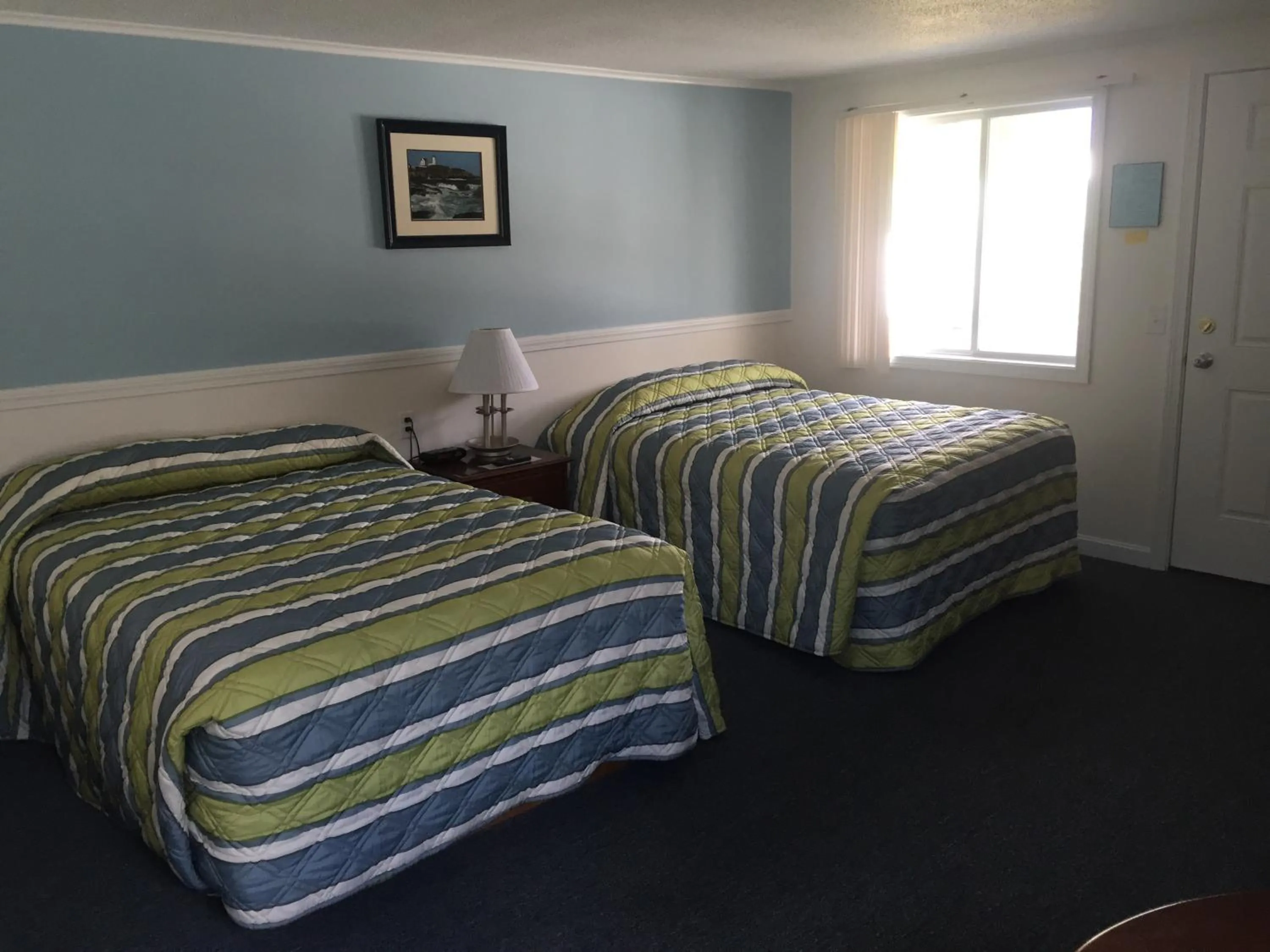 Bed in Ne'r Beach Motel