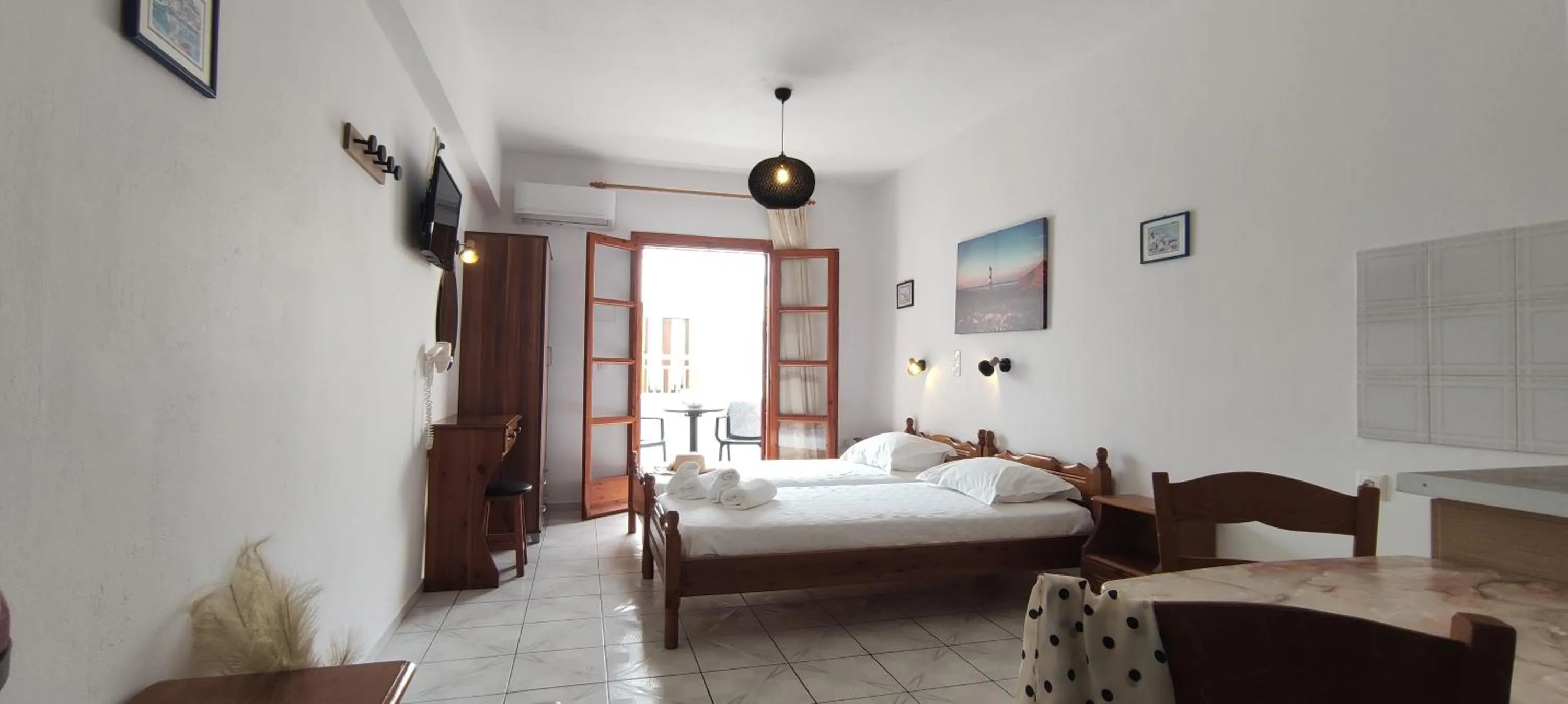 Bed in Kapetanos Rooms